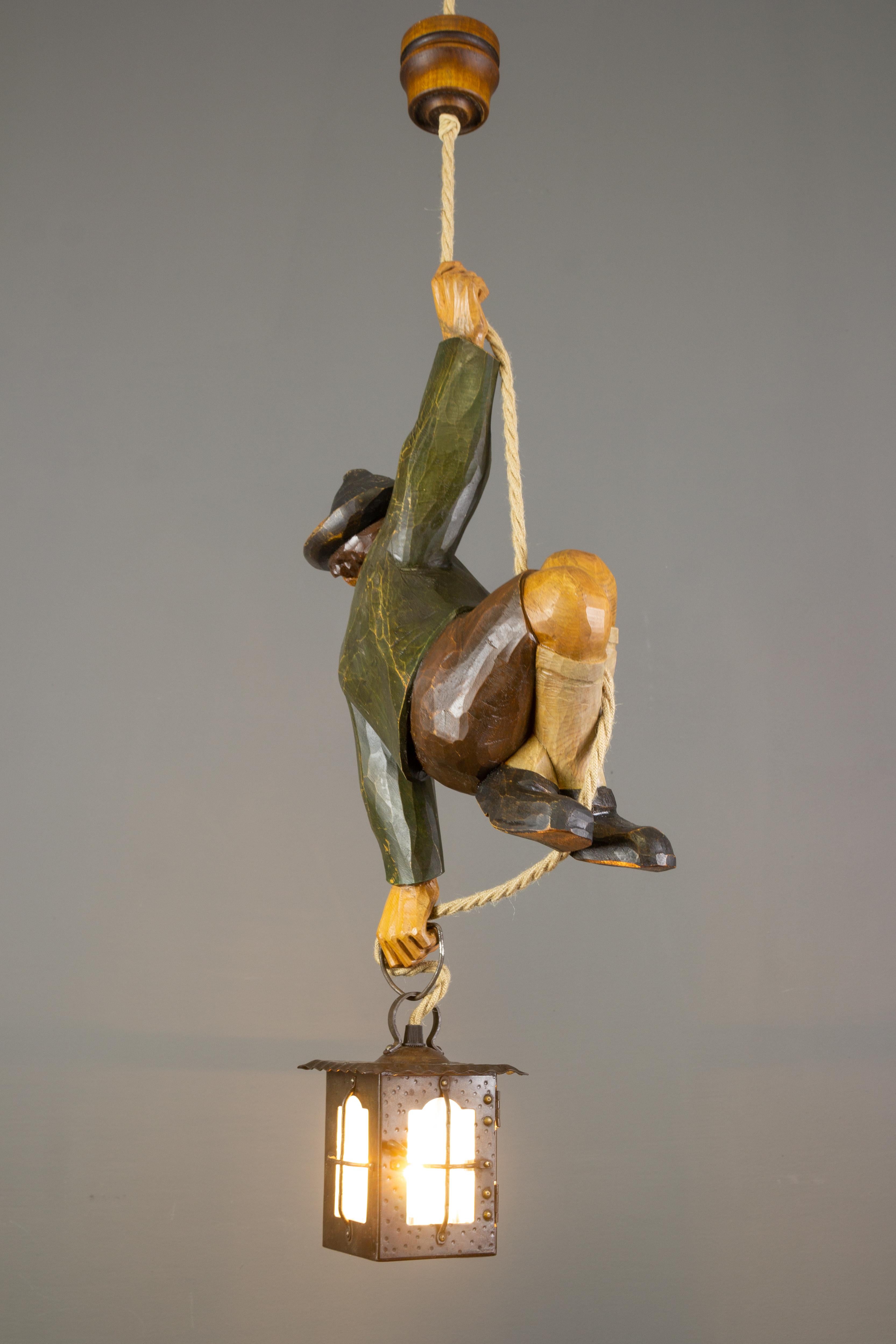 Black Forest German Hanging Lamp with Hand Carved Sculpture of Mountain Climber and a Lantern