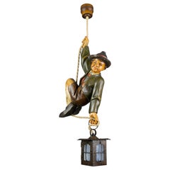 German Hanging Lamp with Hand Carved Sculpture of Mountain Climber and a Lantern