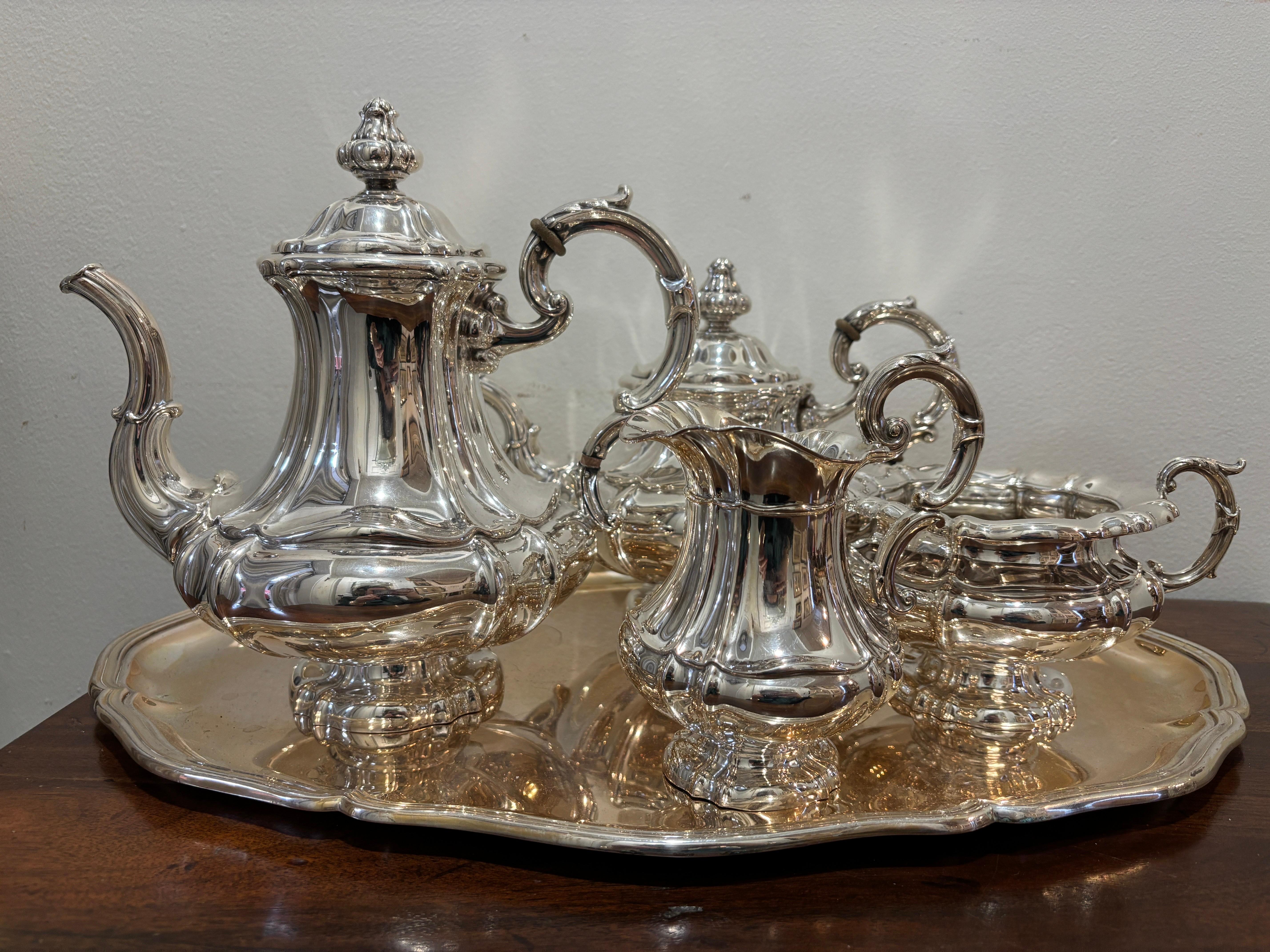 For your consideration we have this stunning European silver coffee and tea service set.  It is a very elegant and timeless design complete with it's original serving tray.

Carl Heisler is a German silversmith known for producing high-quality