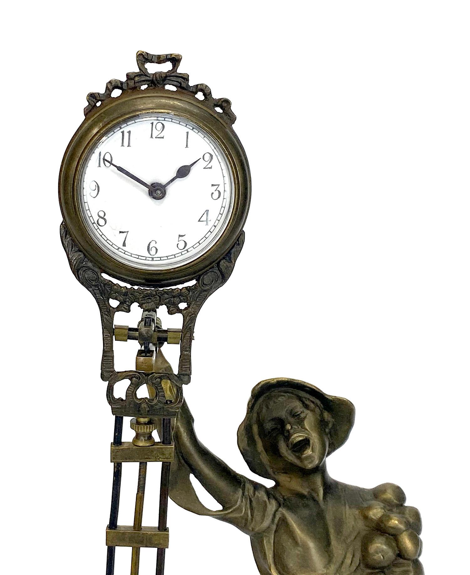 20th Century German Junghans Style Brass Onion Boy Figure Swinging Clock For Sale