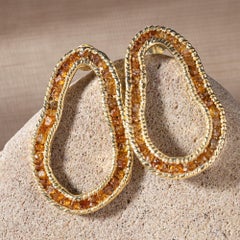 German Kabirski Arven Pendientes de plata dorada con granate espessartina en bruto