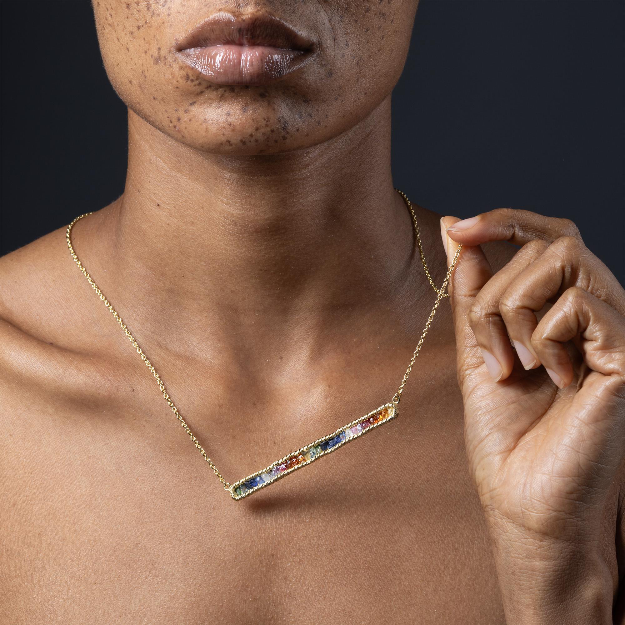 The necklace features a slim, linear construction in 925 silver, plated with 14K gold. A line of natural raw sapphire crystals is set using a proprietary setting technique developed by German Kabirski - highlighting the stones' natural forms without