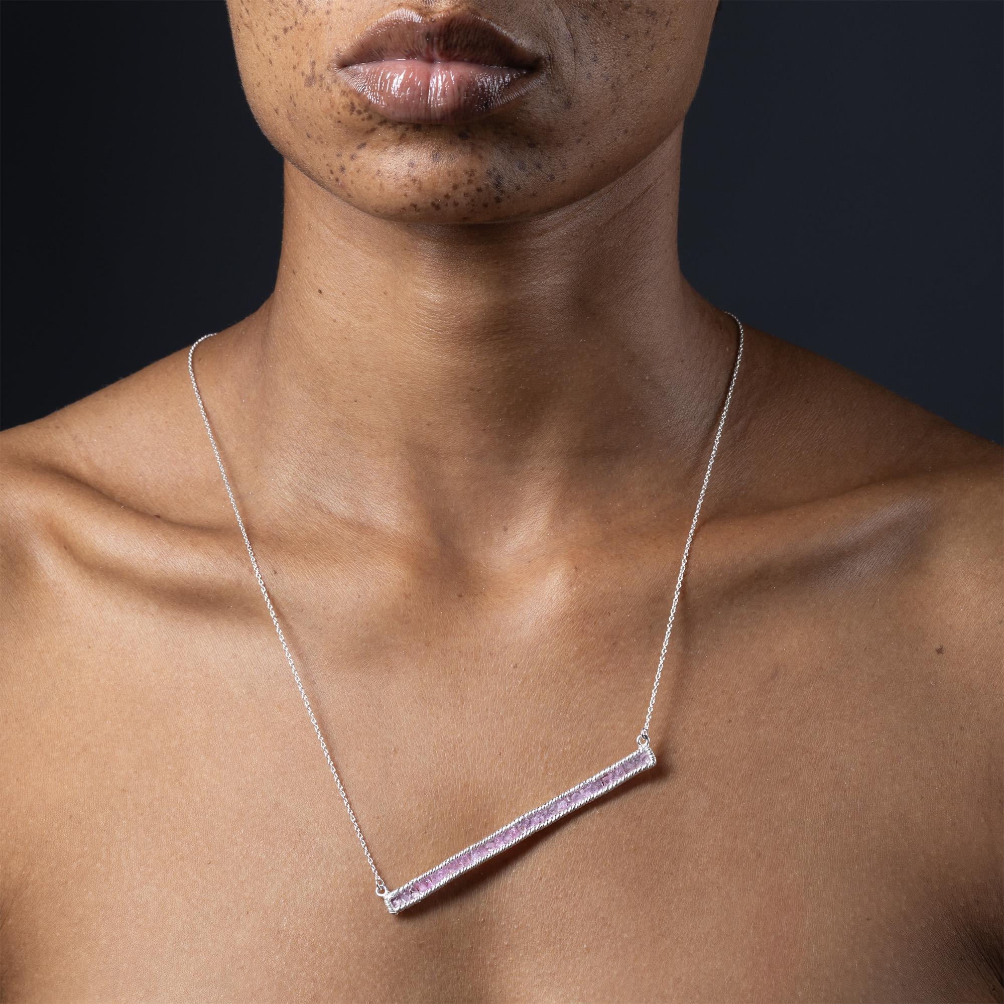The Lithos Necklace from the GKey Collection brings together raw natural elements and clean structural design. Set along a slim line of 925 sterling silver with an anti-tarnish coating, unpolished raw pink sapphires maintain their original surface