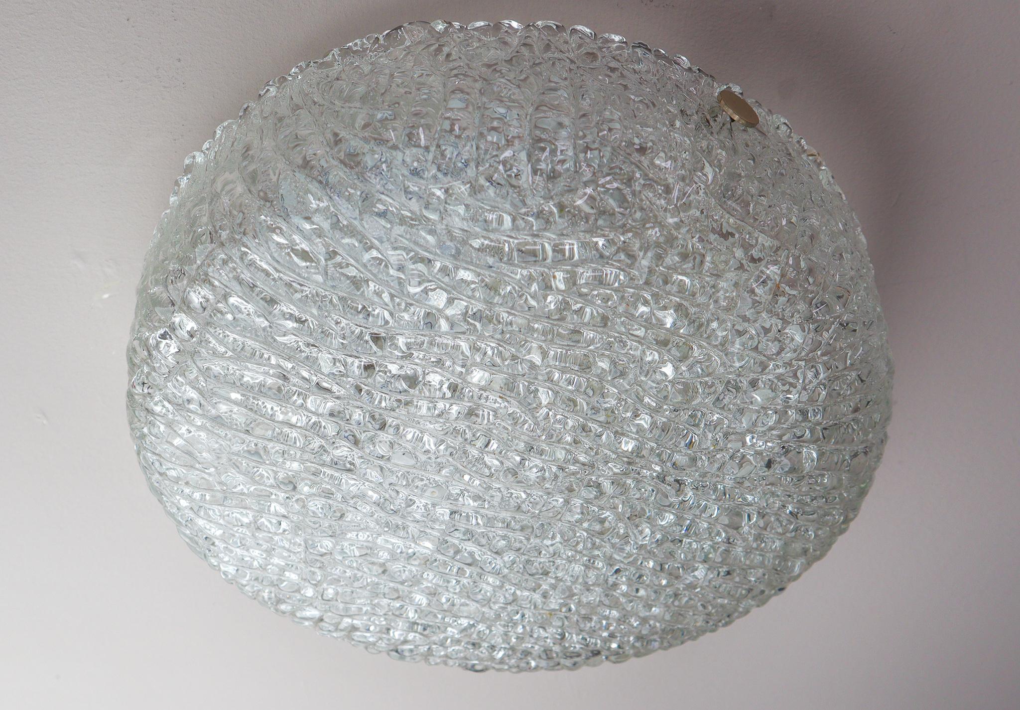 Gorgeous flush mount ceiling light made of heavy textured clear iced glass on a white metal frame with nickel finals. Manufactured by Kaiser Lighting, Germany in the 1960s. Manufactured by Kaiser Lighting, Germany in the 1960s. Very good vintage