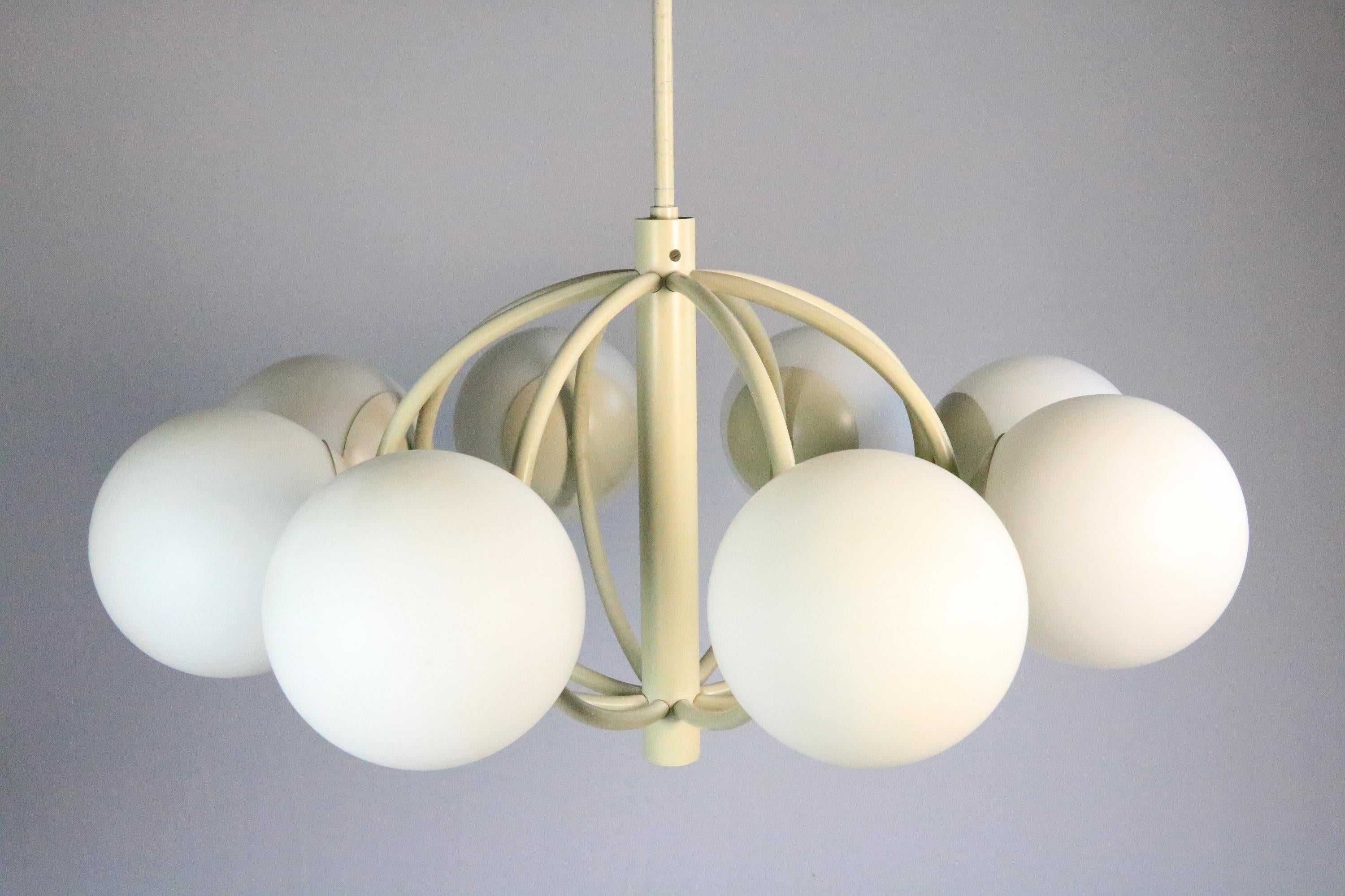 Beautiful classic light from the 1970s.
 
A chandelier in Sputnik design, with eight glass balls and cream-colored metal frame.
 
Manufacturer : Kaiser Leuchten
 
Diameter: 55 cm / 21.65 inches
Diameter ball: 13 cm / 5.12 inches
Total height: 65 cm