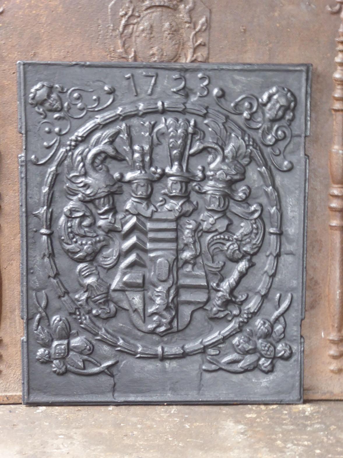 German Louis XV style fireback with an unknown coat of arms.

The fireback is made of cast iron and has a black / pewter patina. The condition is good. It does not have cracks.

 