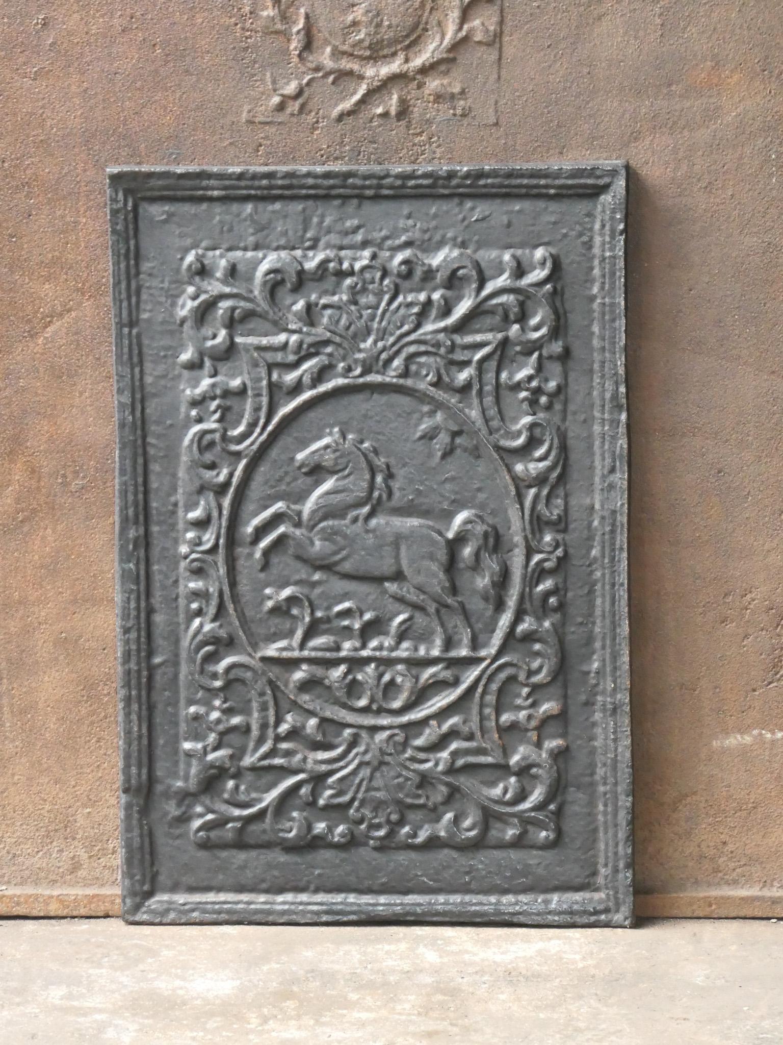 20th Century German Louis XV style fireback with a horse. 

The fireback is made of cast iron and has a black / pewter patina. It is in a good condition and does not have cracks.







