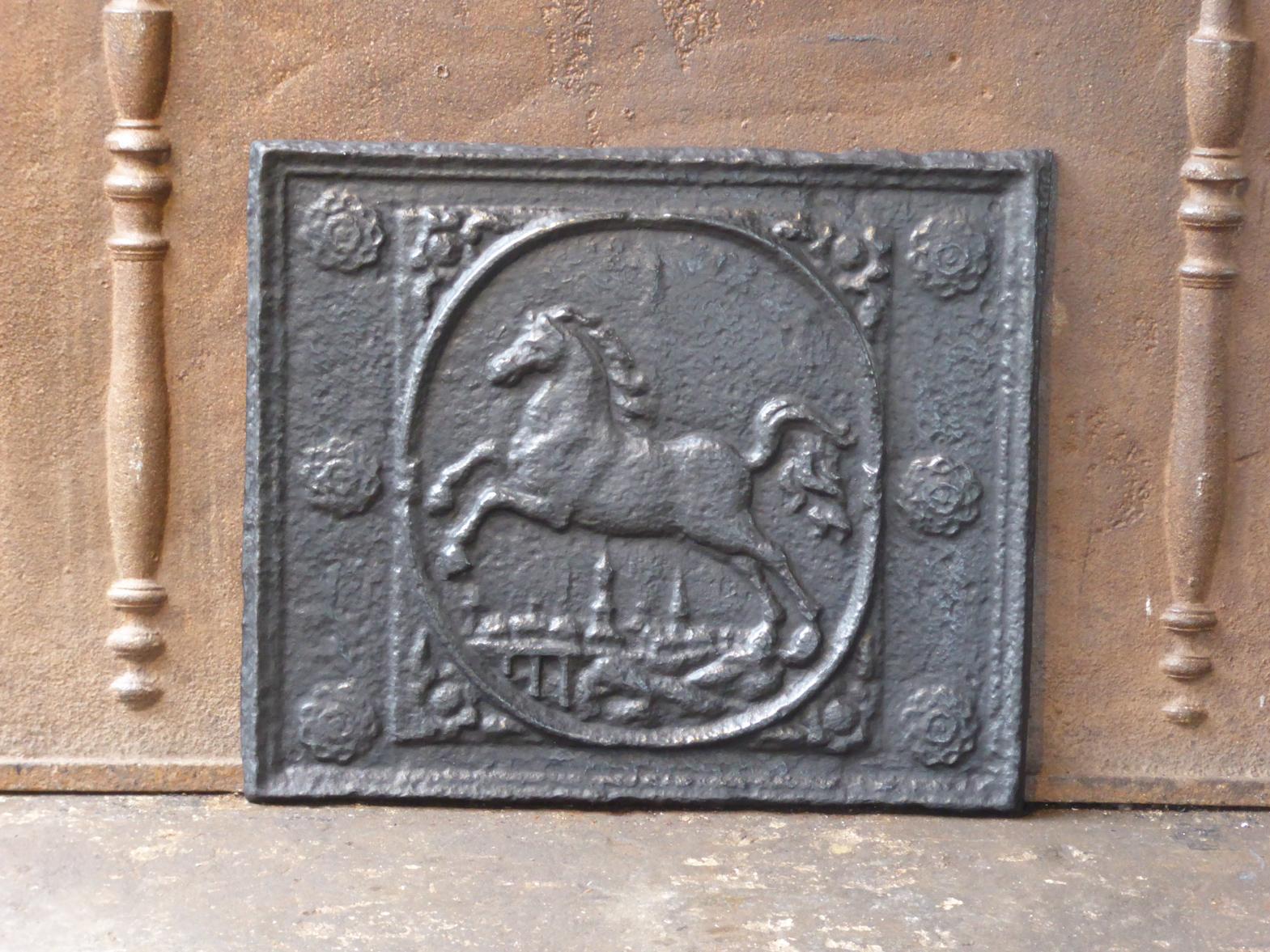 20th Century German Louis XV style fireback with a horse. 

The fireback is made of cast iron and has a black / pewter patina. It is in a good condition and does not have cracks.







