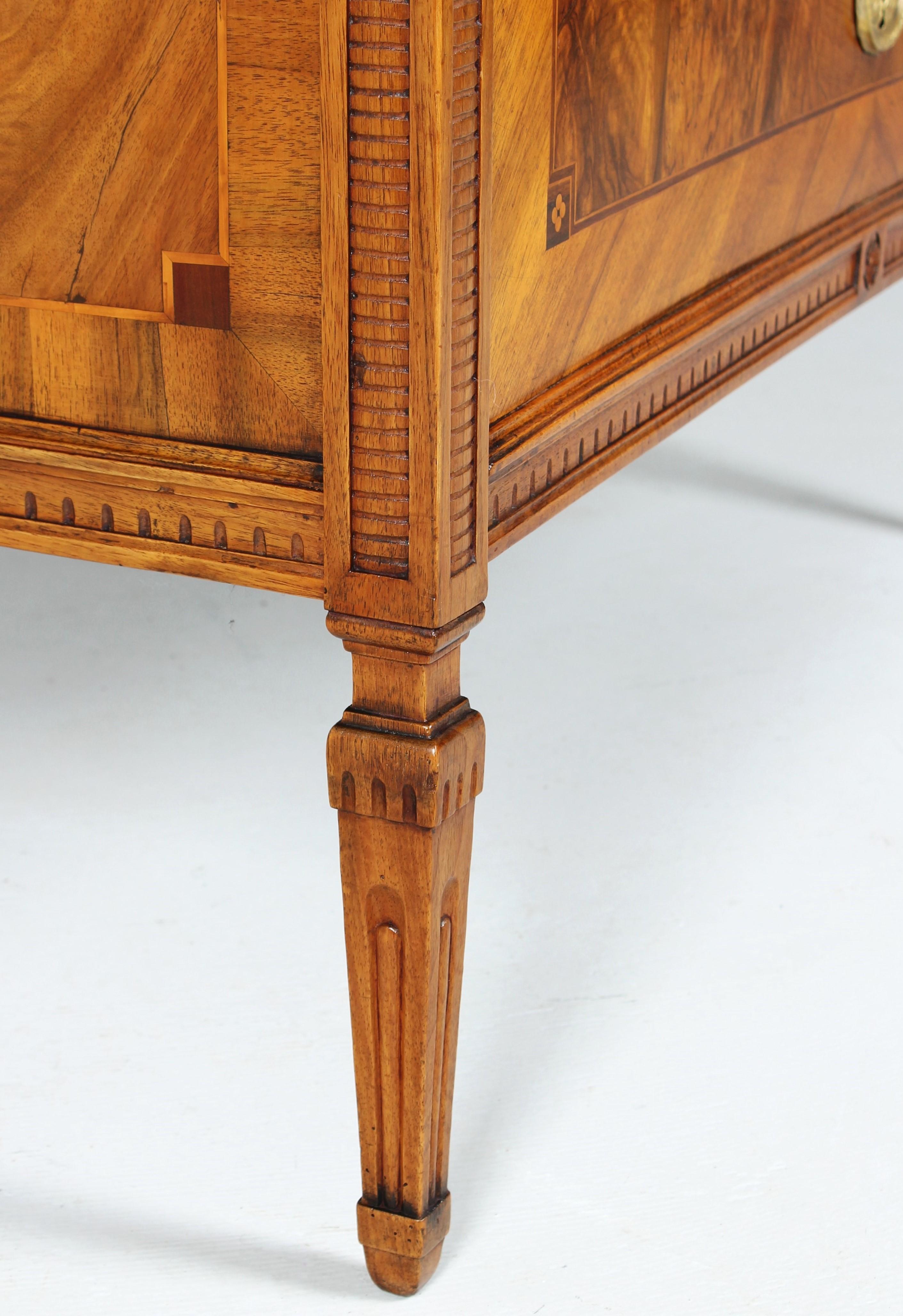 Walnut German Louis XVI Chest Of Drawers with Carvings and Marquetry, circa 1780 For Sale