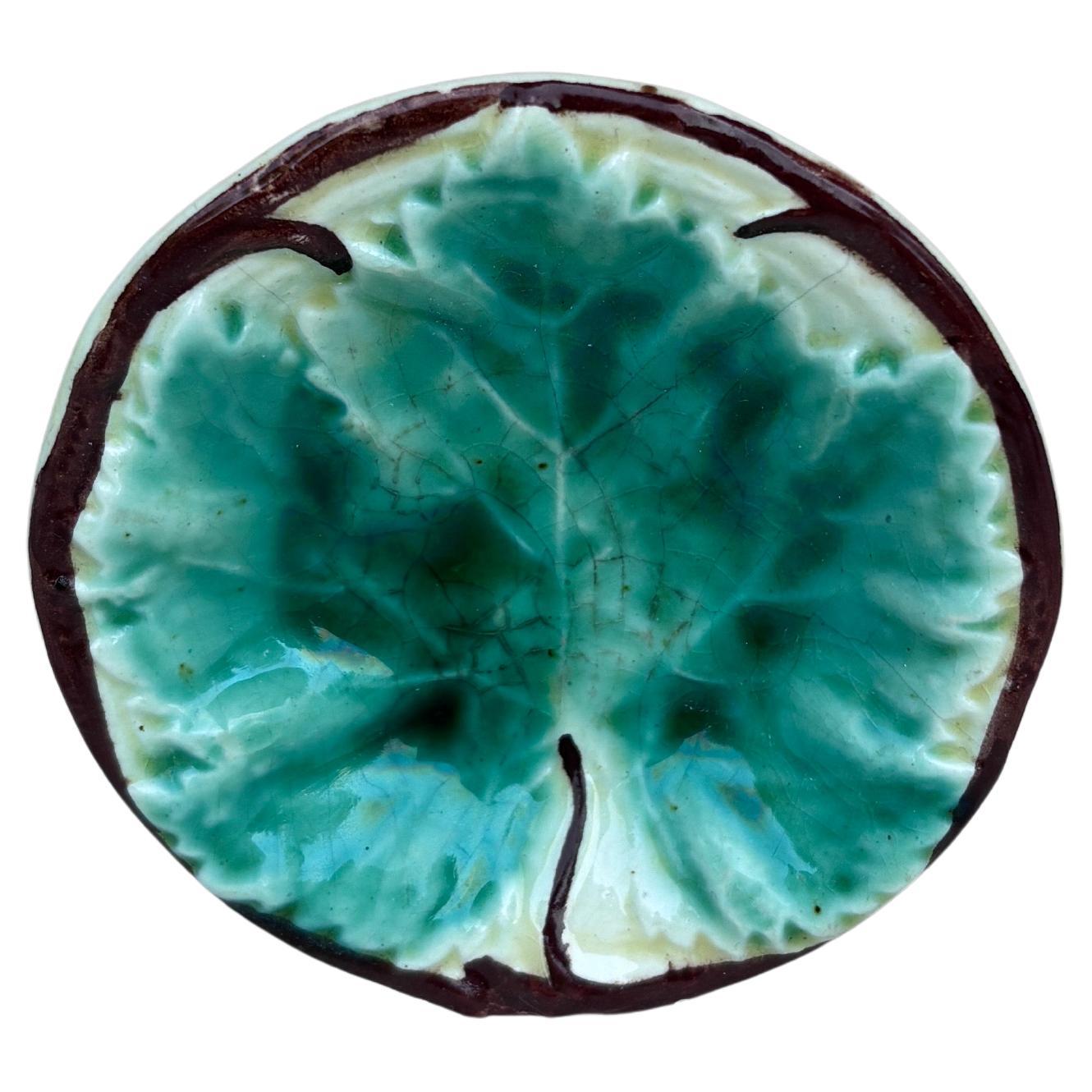German Majolica Butter Pat with Leaf, circa 1900.
Diameter / 3 inches.
6 available.
 