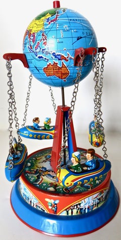 German Mechanical Carousel Rocket Lithographed Tin Toy, Circa 1950's