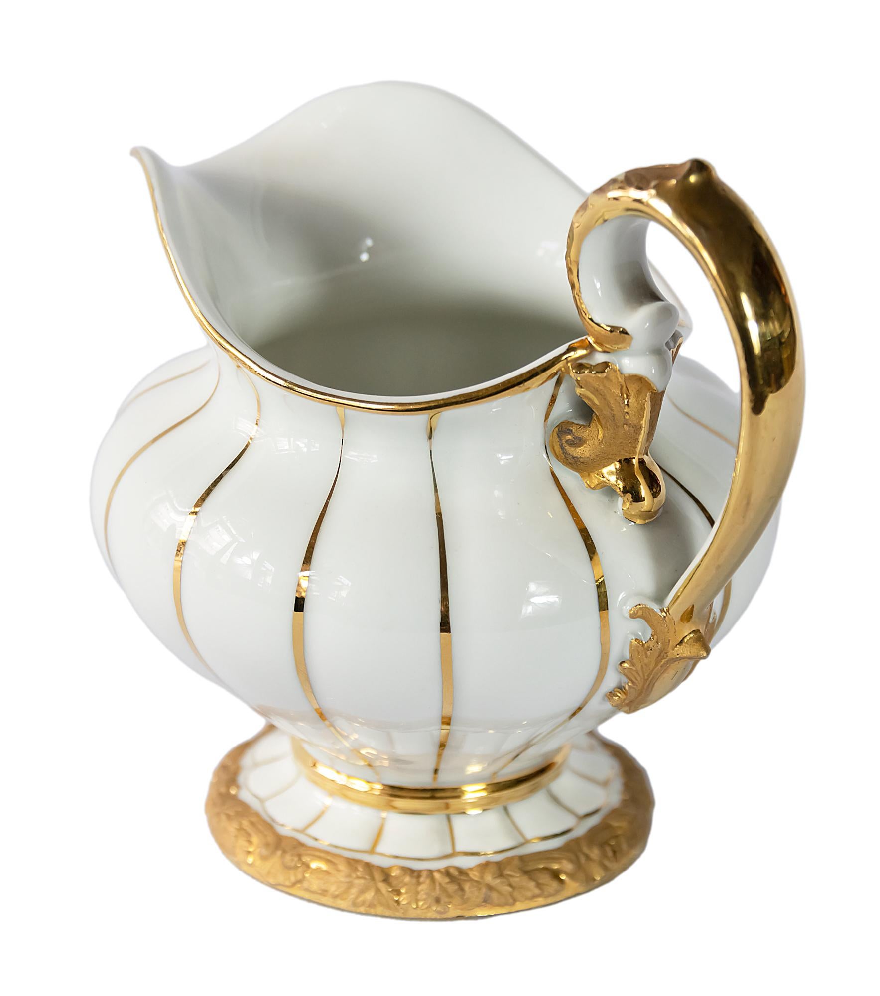 German Meissen porcelain milk pitcher / jug.
Porcelain is hand painted with gold.
The logo marked on the bottom.