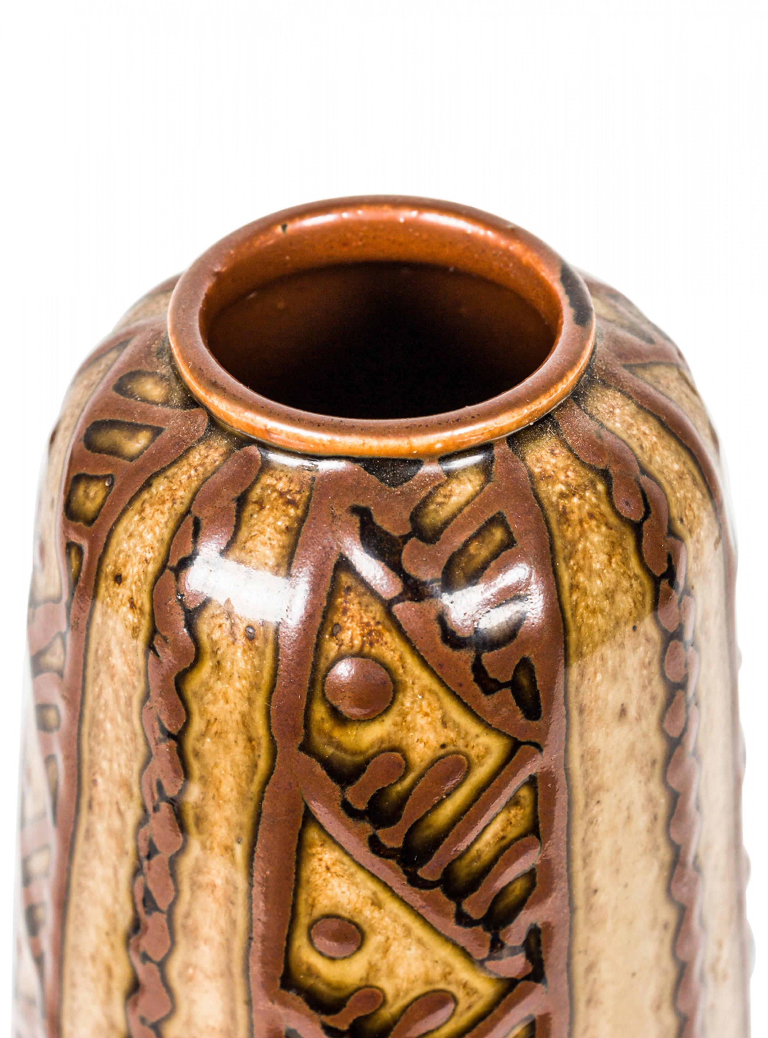 German mid-century tapered cylindrical ceramic vase with a raised brown diagonal and vertical line and dot pattern against a gold and brown glazed ground. (mark on bottom).