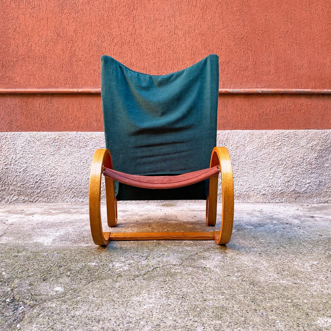 German Mid-Century Modern curved solid wood and fabric armchair by Westnofa, 1960s.
Armchair with curved solid wood structure with armrests. Seat and back in rigid fabric in the respective brown and dark green colors.
Made by Westnofa in