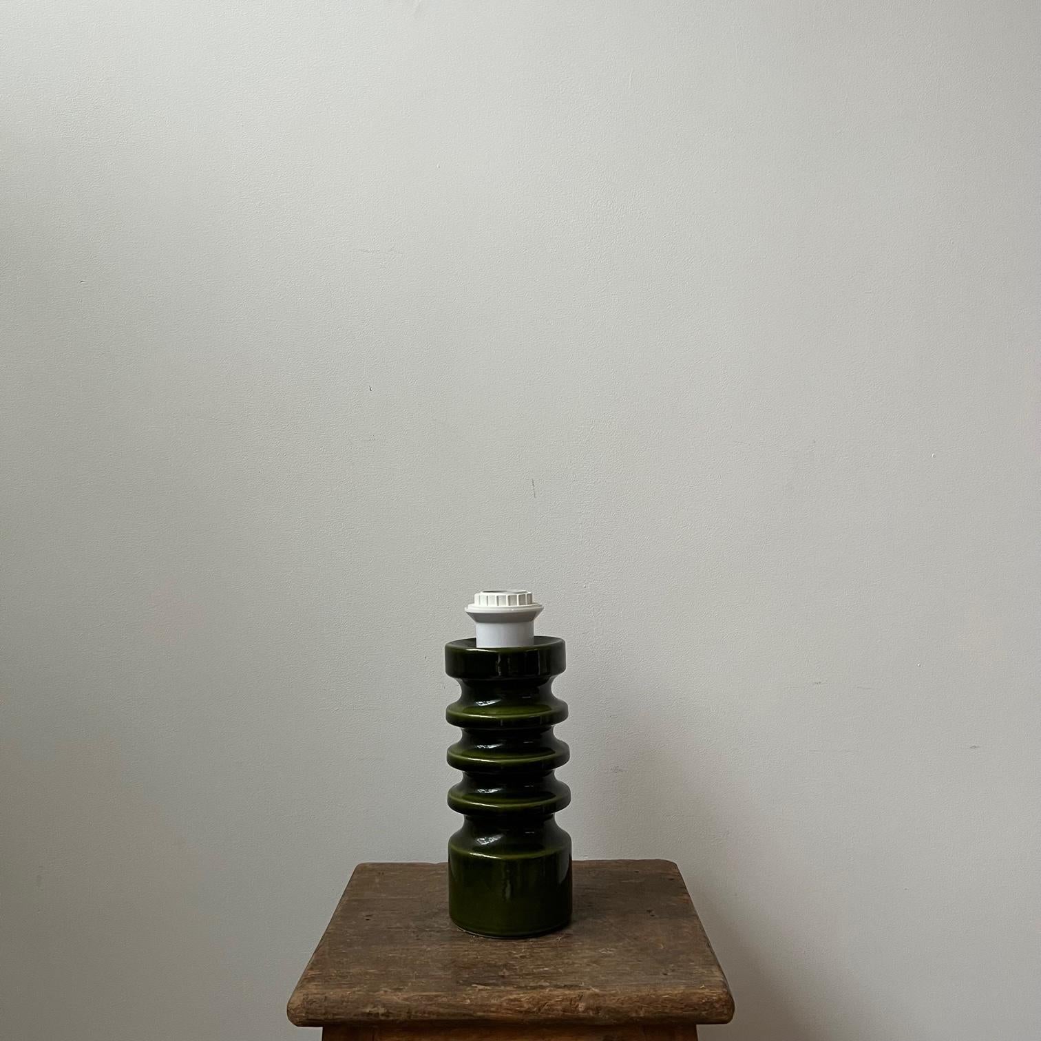 A ceramic green table lamp. 

Stamped to the underside. 

Germany, c1970s. 

A petite lamp, very stylish. 

Since re-wired and PAT tested. 

Location: London Gallery.

Dimensions: 26 height x 10 diameter in cm.

Delivery: POA

 