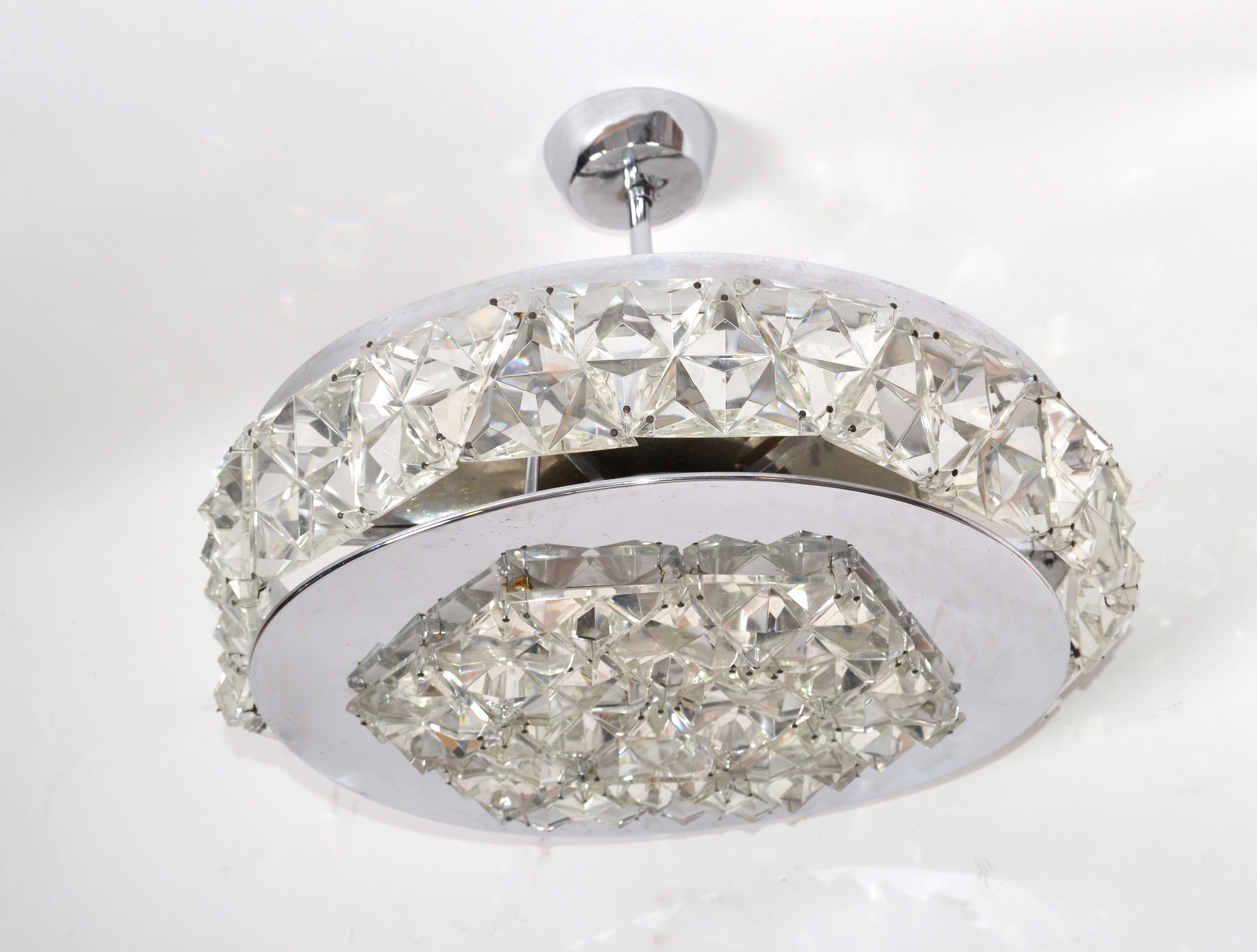 Kinkeldey Classic German 1970s chrome and crystals flushmount, ceiling light, light fixture from the late 1970s.
In working condition and uses 6 small European 40 watts light bulbs.
 