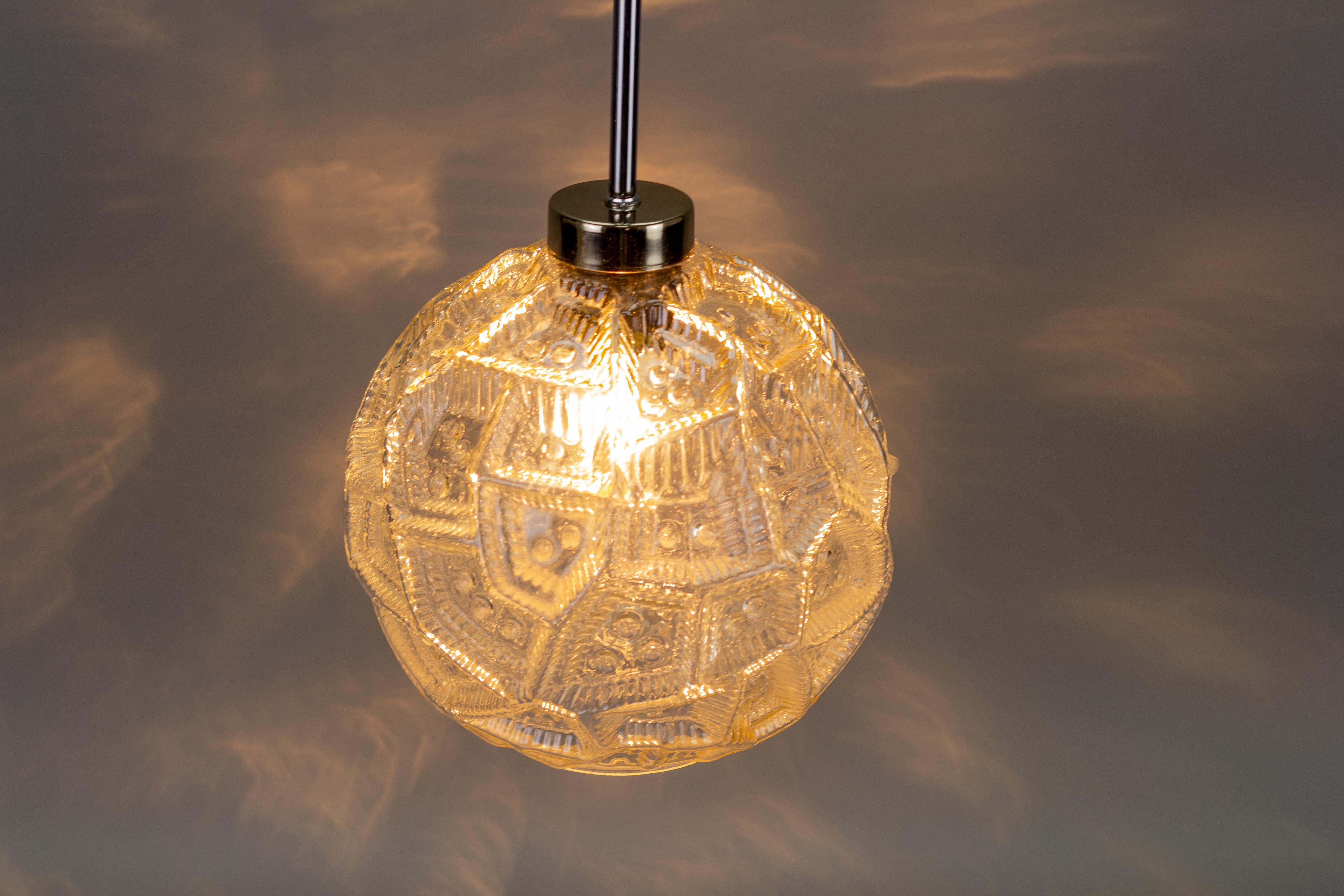 Late 20th Century German Mid-Century Modern Clear Glass Globe and Chrome Pendant Light For Sale