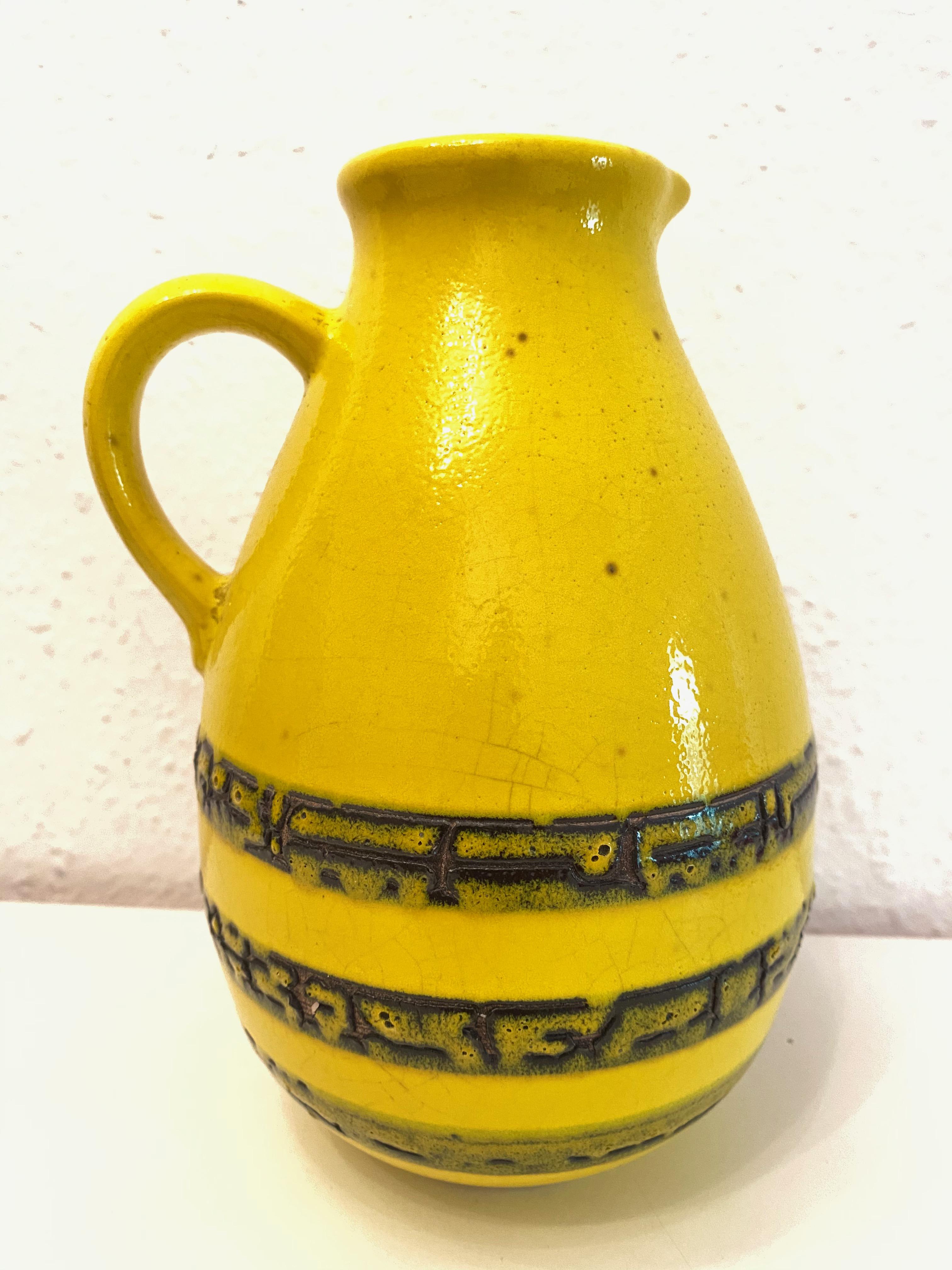 An amazing midcentury studio art pottery vase made in Germany, circa 1970s, by Steuler Keramik. Vase is in very good condition with no chips, cracks, or flea bites. Only some hairline cracks in the glaze, but this is old-age. Signed with makers mark.