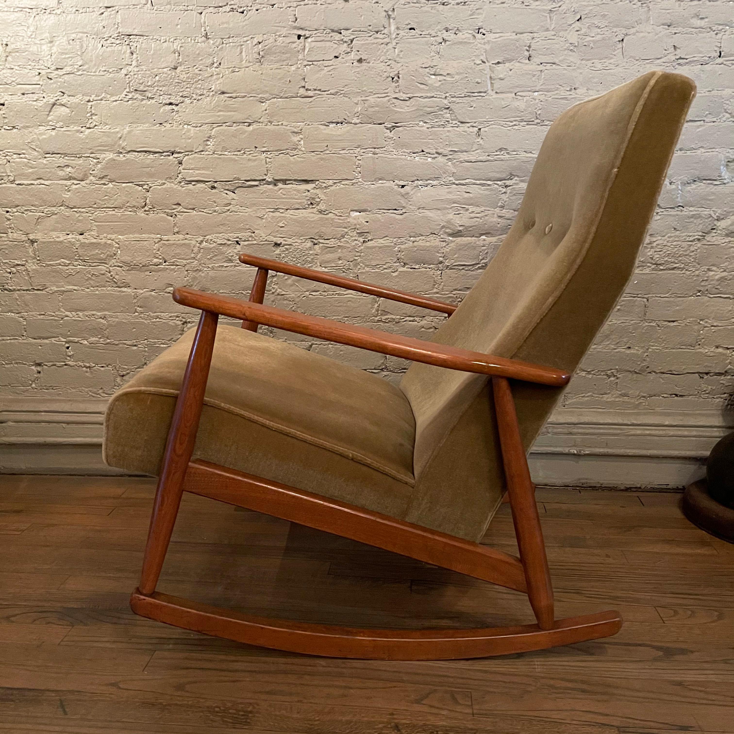 Comfortable and stylish, German, Mid-Century Modern, rocking chair features a highback, beech frame upholstered in a cozy, moss green mohair.