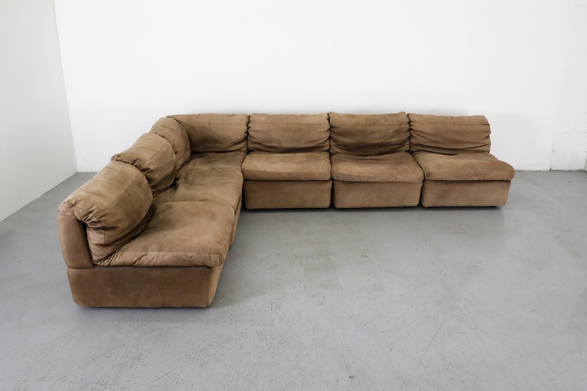 A beautifully upholstered six-piece sofa by Rolf Benz, this striking example of late mid-century German design is covered in natural buck leather that has developed a rich patina over time. Founded in 1964, Rolf Benz emerged as one of Germany's most