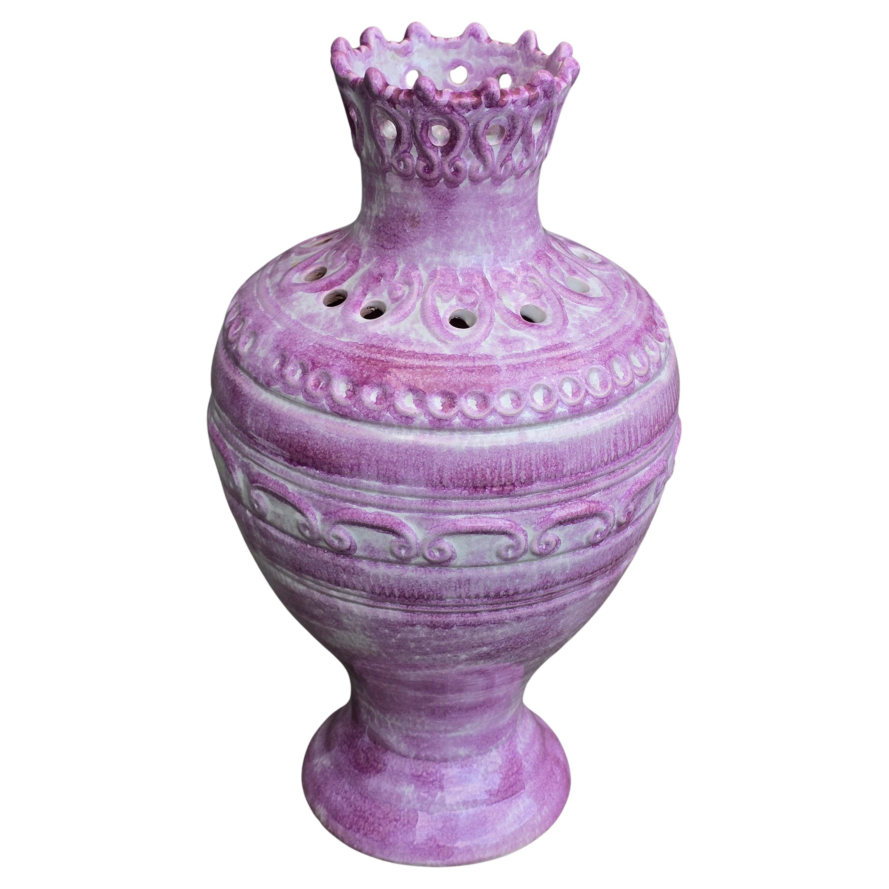 Sculptural German ceramic vase, circa 1950s, featuring a pierced crown-like collar and richly modeled body with a hand-applied violet and white glaze. Marked on the underside “Made in Germany” and model number 2050/45. A striking decorative accent