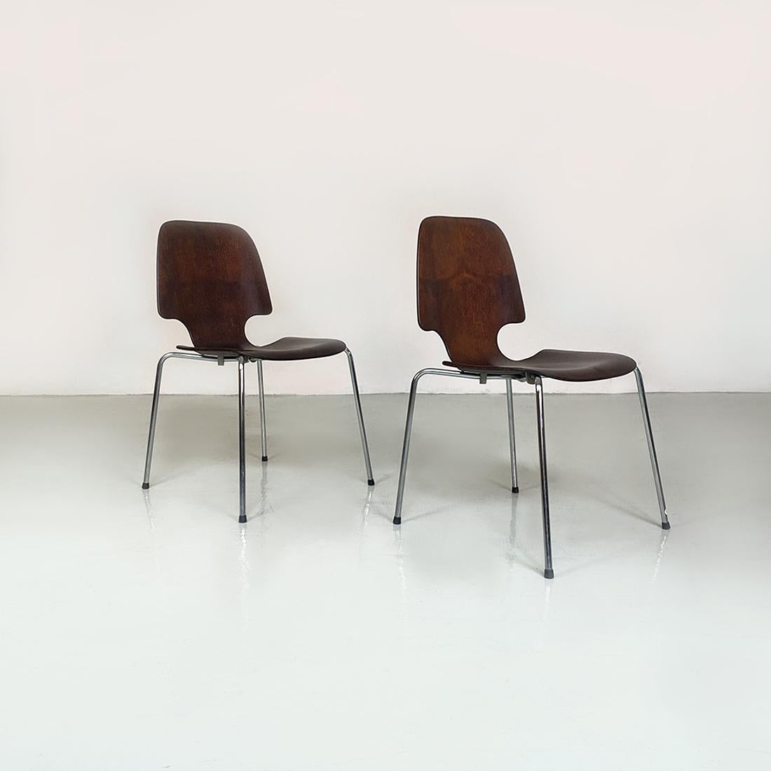 German Mid-Century Modern pair of dark wood single shell and chromed steel rods legs chairs, 1960s
Set of two German chairs, with single shell in dark wood, curved with a contoured shape and legs in chromed steel rod, with round metal detail in the