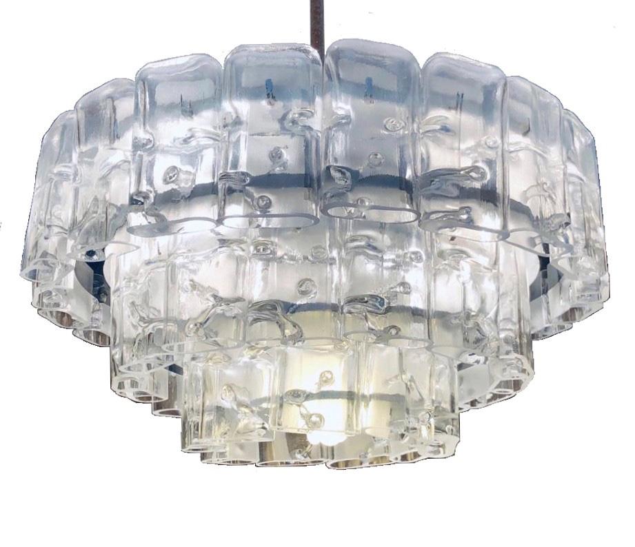 Stunning and beautiful German midcentury glass chandelier. This chandelier was made during the 1970s in Germany by Doria.
This chandelier is composed by 45 units of crystals and metal structure. We include one more glass as replacement.
A