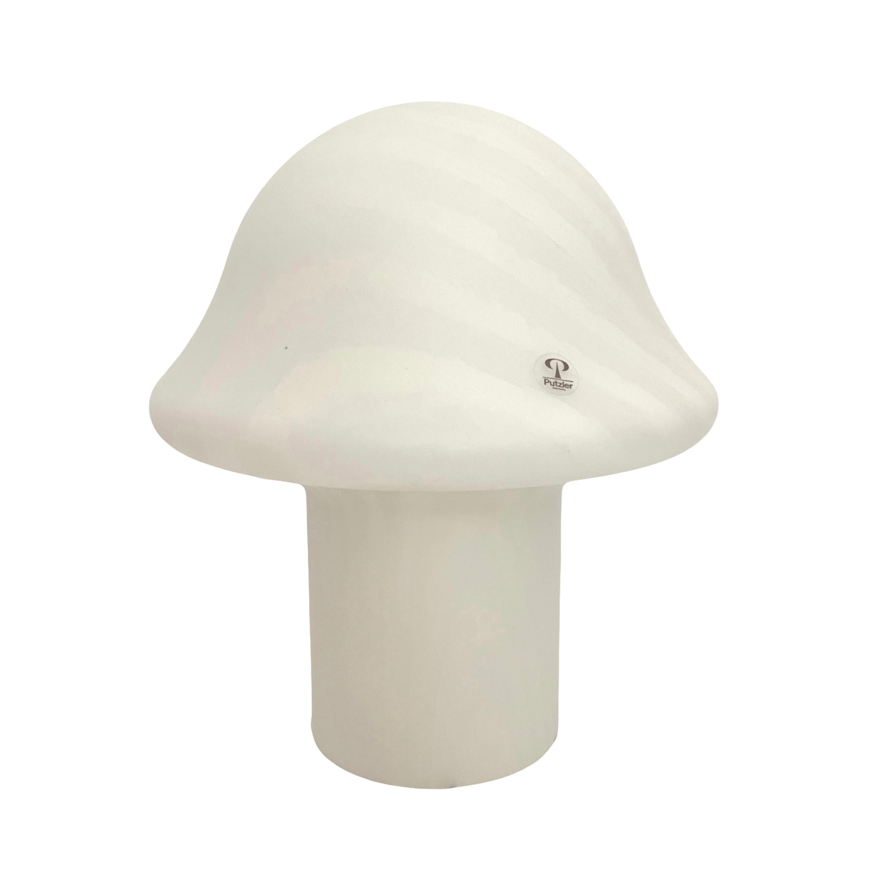 Beauty and lovely German Pair of talian Murano Table Lamps. These Table Lamps were designed and manufactured by Peill & Putzler during the 1970s in Germany. Model: Mushroom 720098. Original sticker label still shows on glass of each Table Lamp.
Each