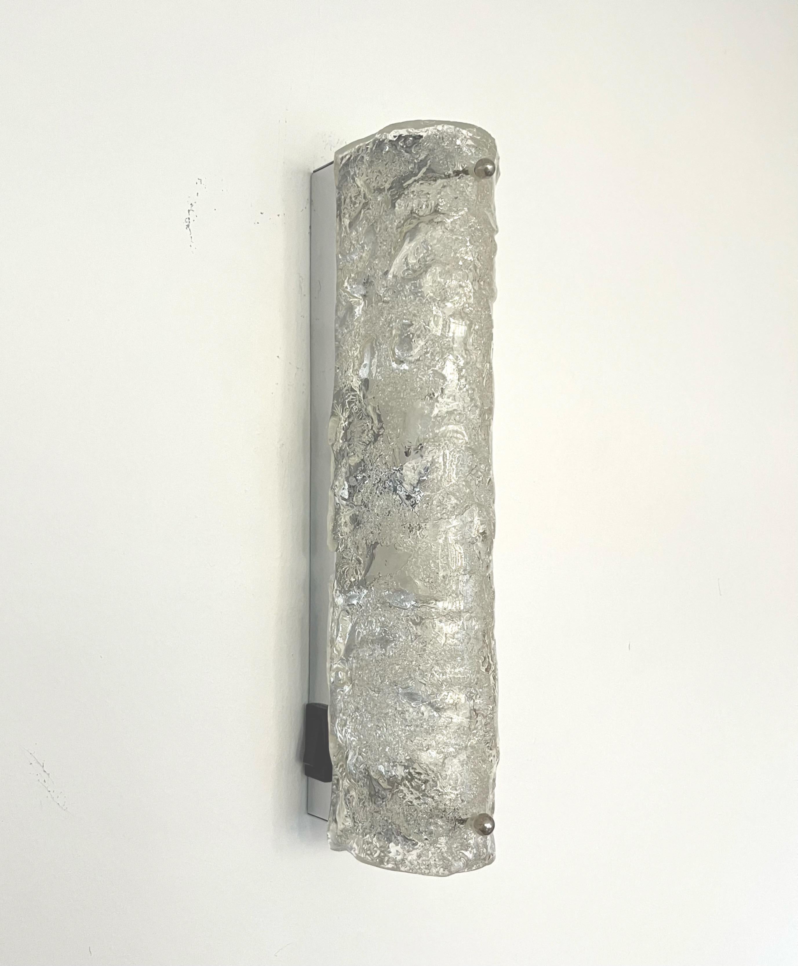 Stunning and beauty Set of Six Murano Ice-glass Wall Sconces by Hillebrand Leuchten. These fixtures were designed and manufactured during the 1970s in Germany. Model 8527-211.
Each Wall Sconce is composed metal structure and a piece of Murano glass.