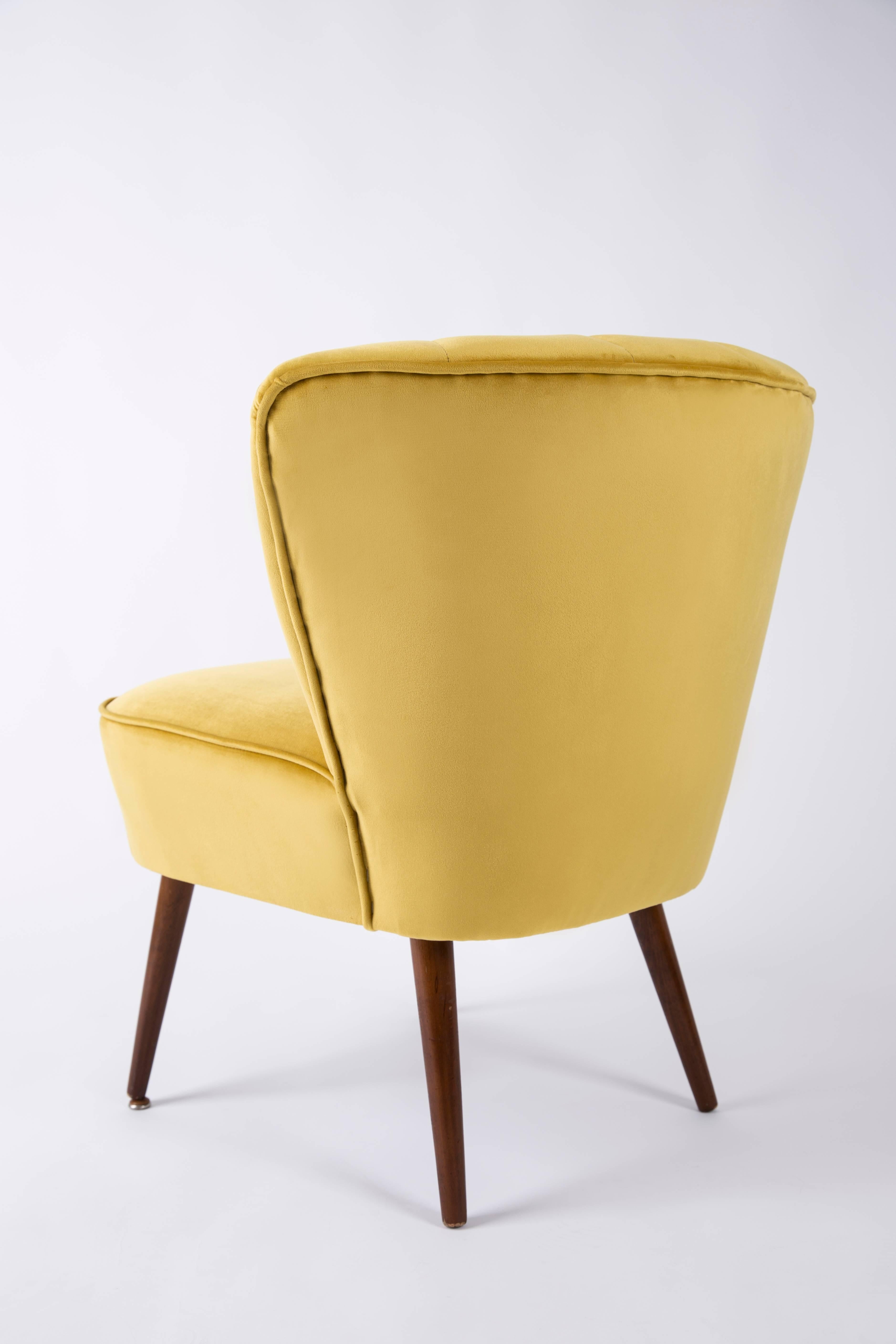 yellow velvet armchair