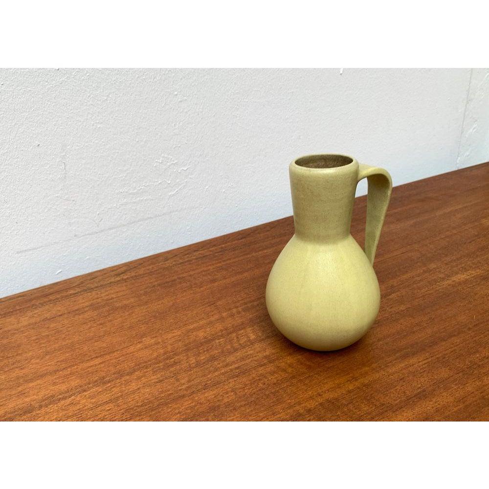 German Minimalist Vase by Hildegard and Peter Delius for Hamelner Töpferei, 1960s, in Very Good conditions. Designed 1960 to 1969 This piece has an attribution mark.

Additional information:
Materials: Ceramic
Color: Yellow
Styles: Mid-Century