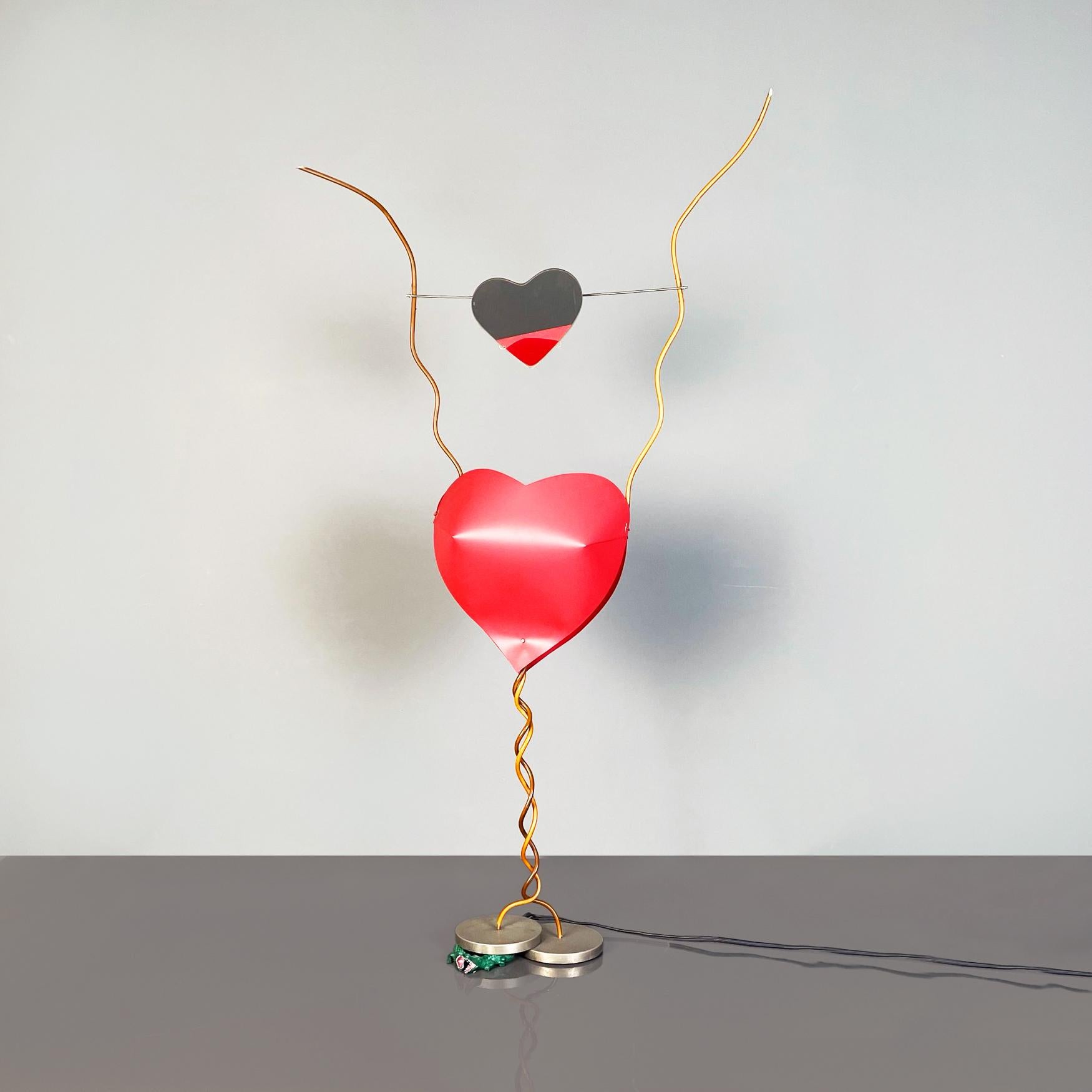 German modern table lamp mod. One From The Heart by Ingo Maurer, 1980s
Elegant and fantastic table lamp mod. One From The Heart with plastic heart-shaped diffuser. Above the diffuser there is a suspended and swiveling heart-shaped mirror, with