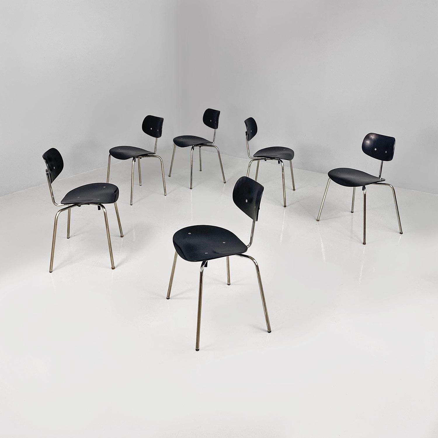 Set of six SE68 model chairs, with structures equipped with four legs in thin-section tubular steel, with a central support on the back, also in metal, to which the oval-shaped backrest is fixed. The seat and backrest are made of black painted and