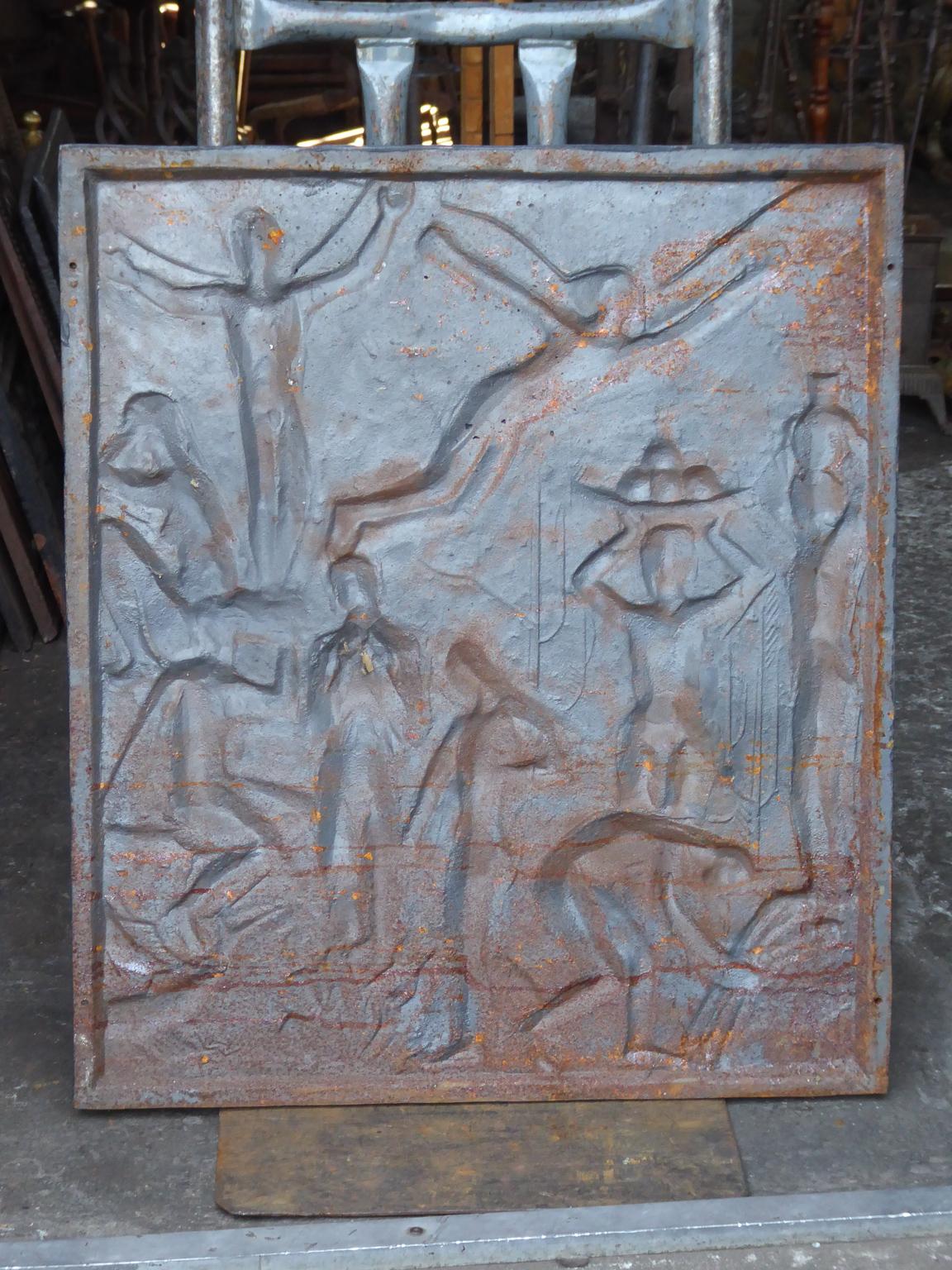 20th century German fireback with a Modernist scene. The fireback is made of cast iron and has a natural brown patina. Upon request the fireback can be made black. It is in a good condition and does not have cracks.






   
    