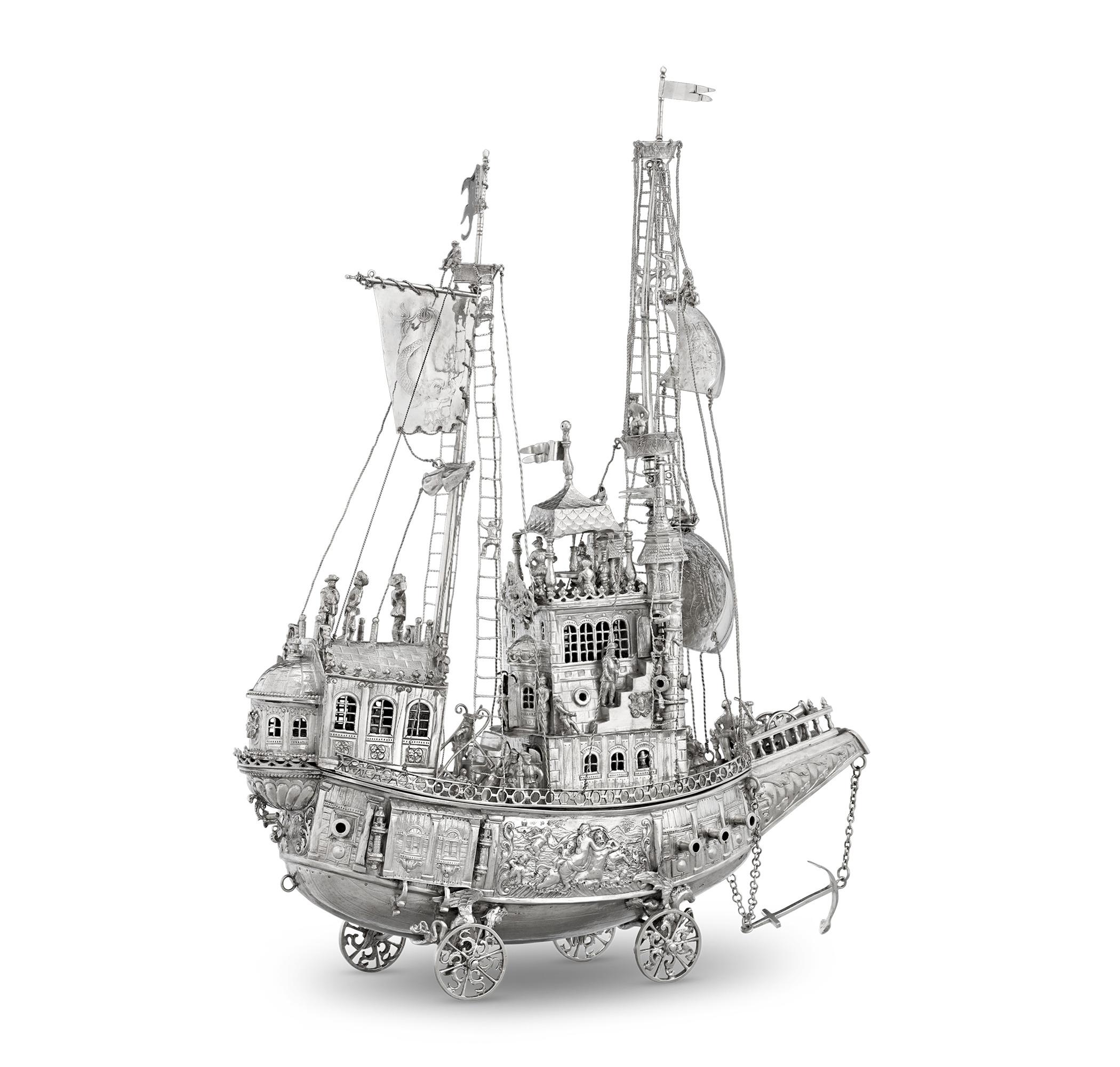 This colossal silver nef is a spectacular example of German silverwork from the town of Hanau. Used as a centerpiece for a table or sideboard, the ship was a visible representation of a patron's wealth. This particular model is quite rare in that it