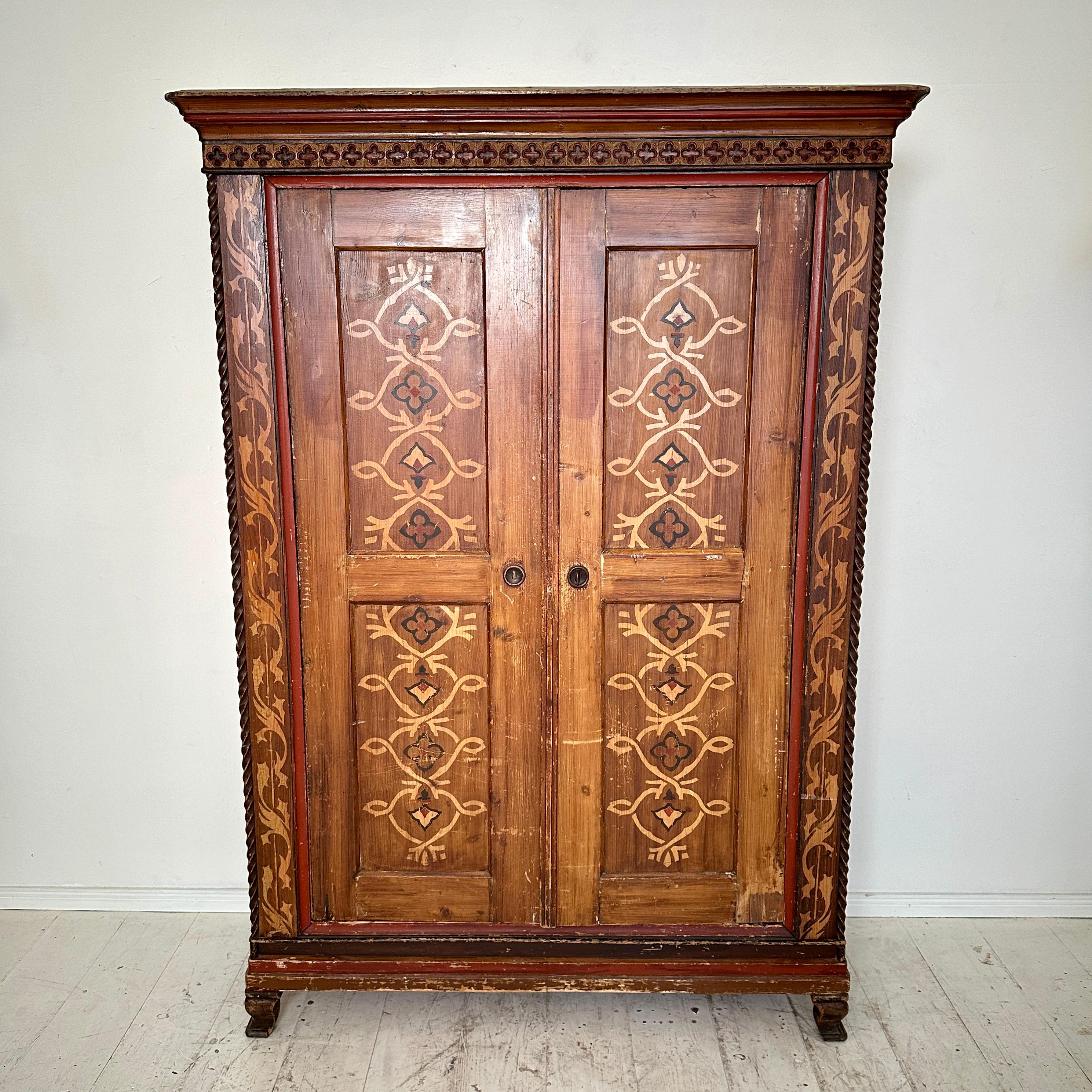 Immerse yourself in the intricate beauty of German craftsmanship with this stunning Neo-Gothic painted and carved cupboard, dating back to around 1870. Rich in history and artistry, this piece captures the essence of the Neo-Gothic movement,