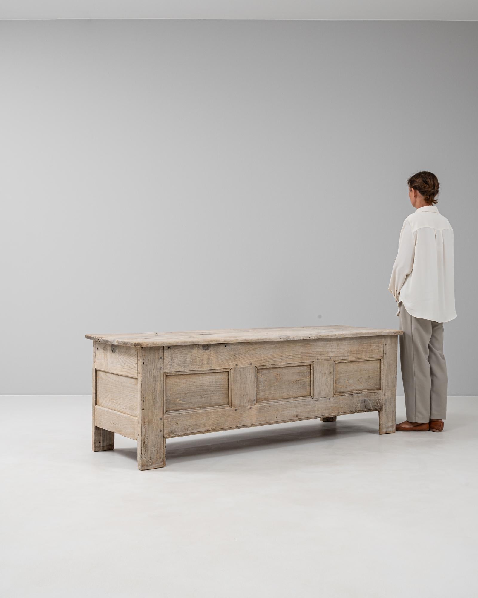 This German oak chest offers a timeless combination of practicality and rustic craftsmanship. Constructed from solid oak, the piece features a plank-built design with a warm, lightly weathered patina that enhances the natural grain and texture of