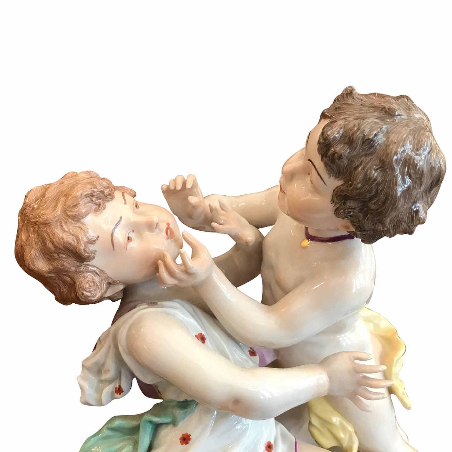 A 20th century bright and polychrome German Passau Porcelain centerpiece with Cherubs, a very decorative oval shaped porcelain sculpture featuring two playing putti figures, seated on a stone.
Good conditions, marked on the bottom by the German