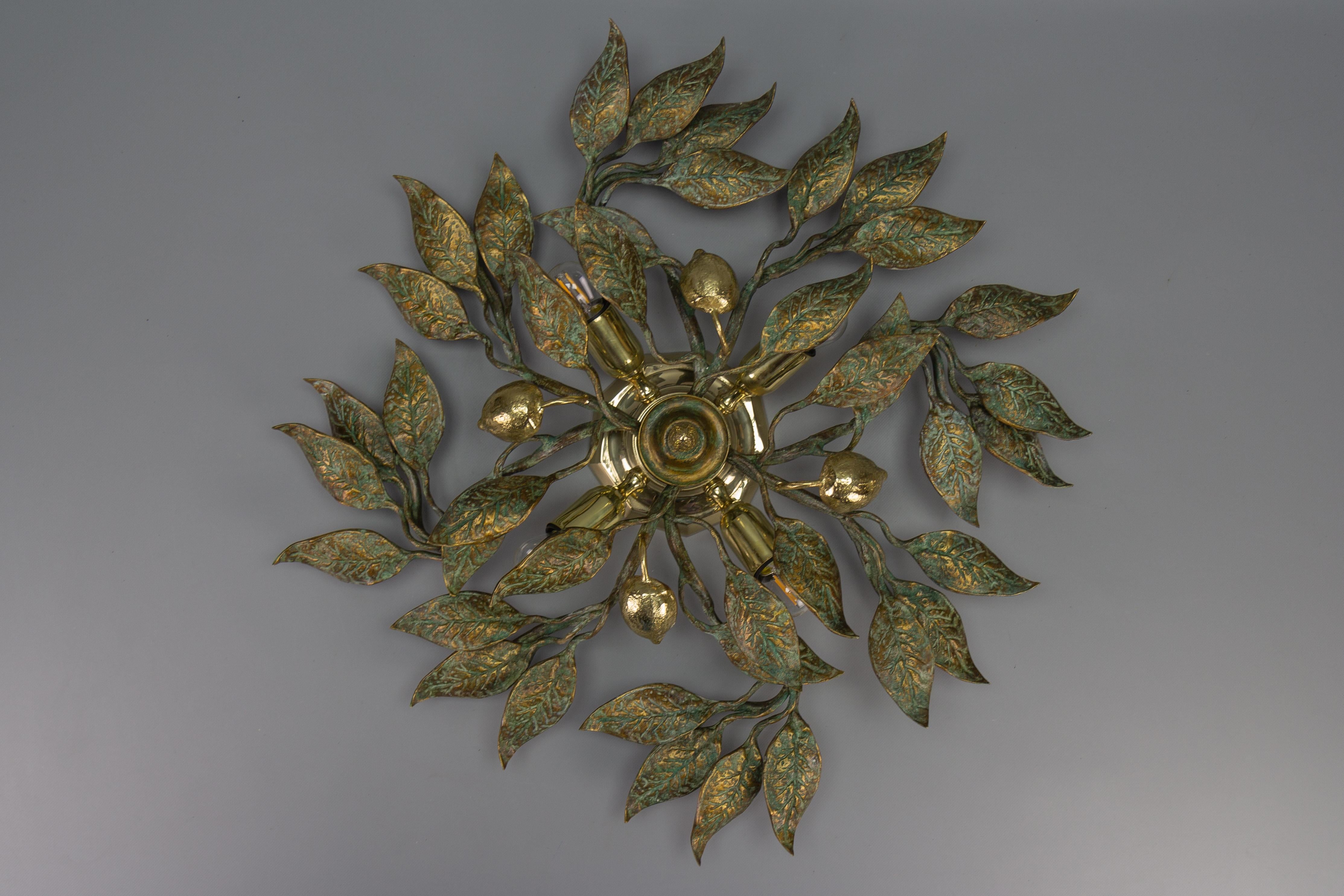 Large patinated brass foliage sunburst flush mount or sconce attributed to Hans Möller, Germany, circa the 1970s.
An impressive, large, and highly decorative four-light sunburst-shaped foliage motif flush mount by Hans Möller; the manufacturer's and
