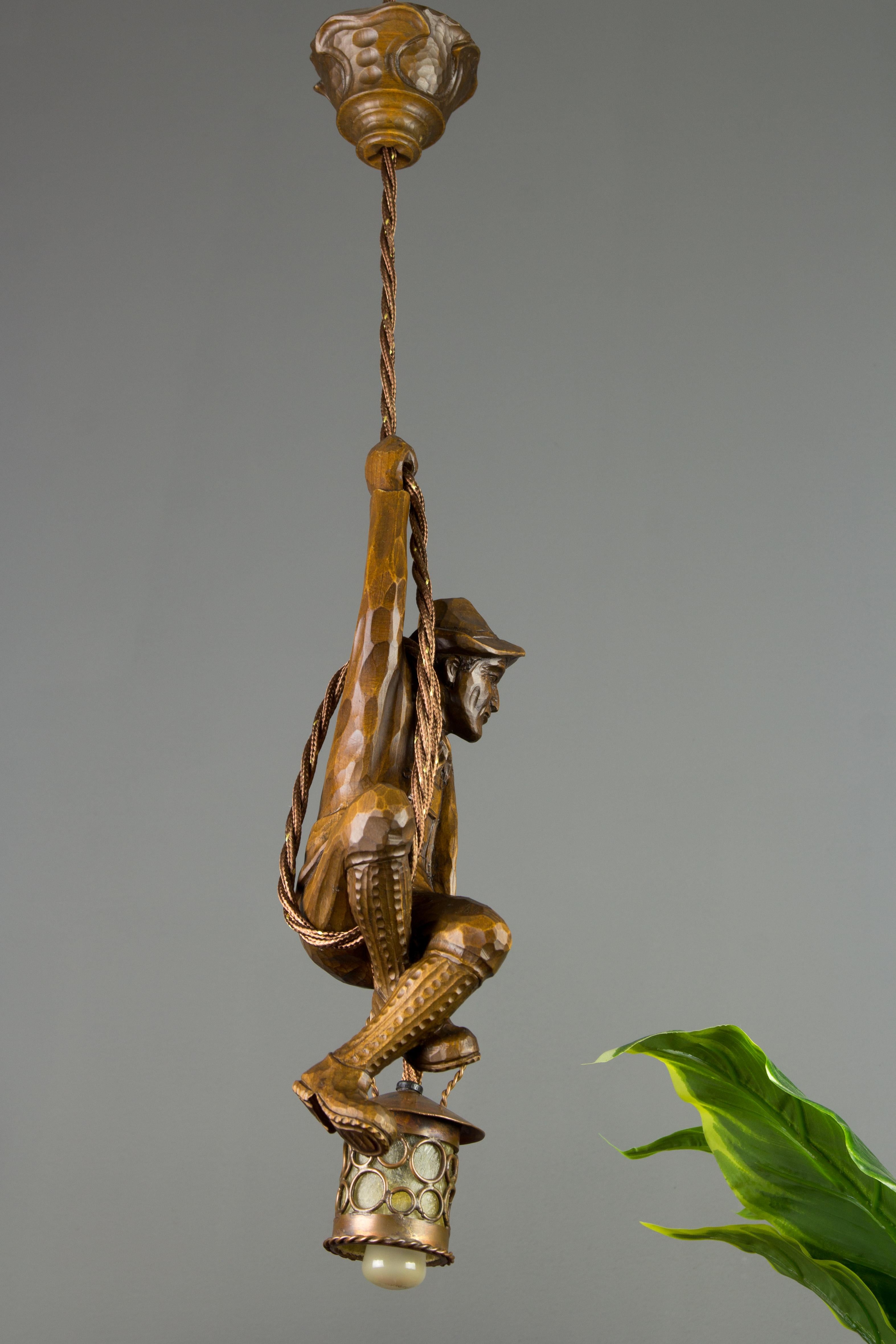 Hand-Carved German Pendant Light Hand Carved Wood Figure Mountain Climber with Lantern For Sale