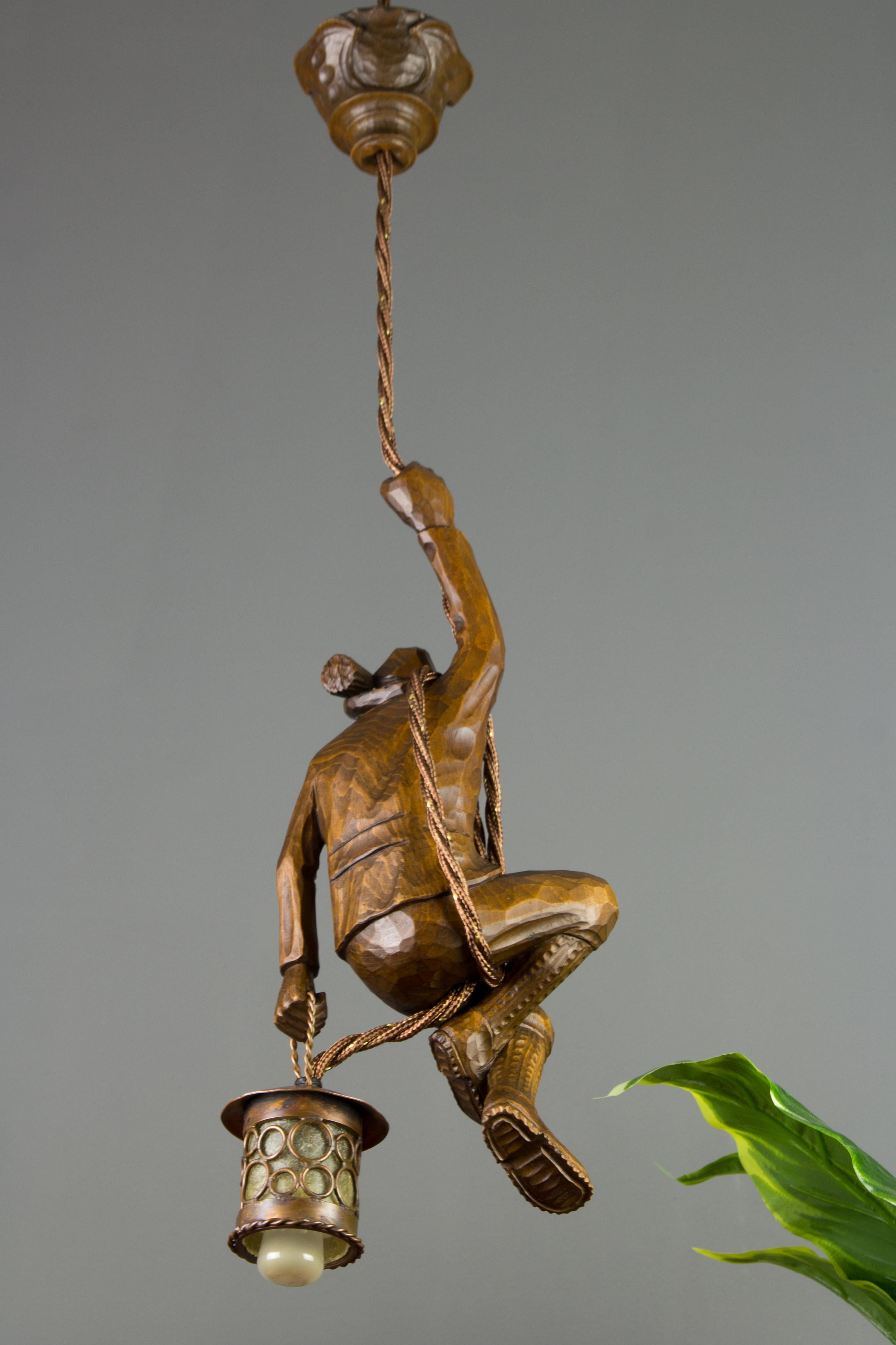 Mid-20th Century German Pendant Light Hand Carved Wood Figure Mountain Climber with Lantern For Sale