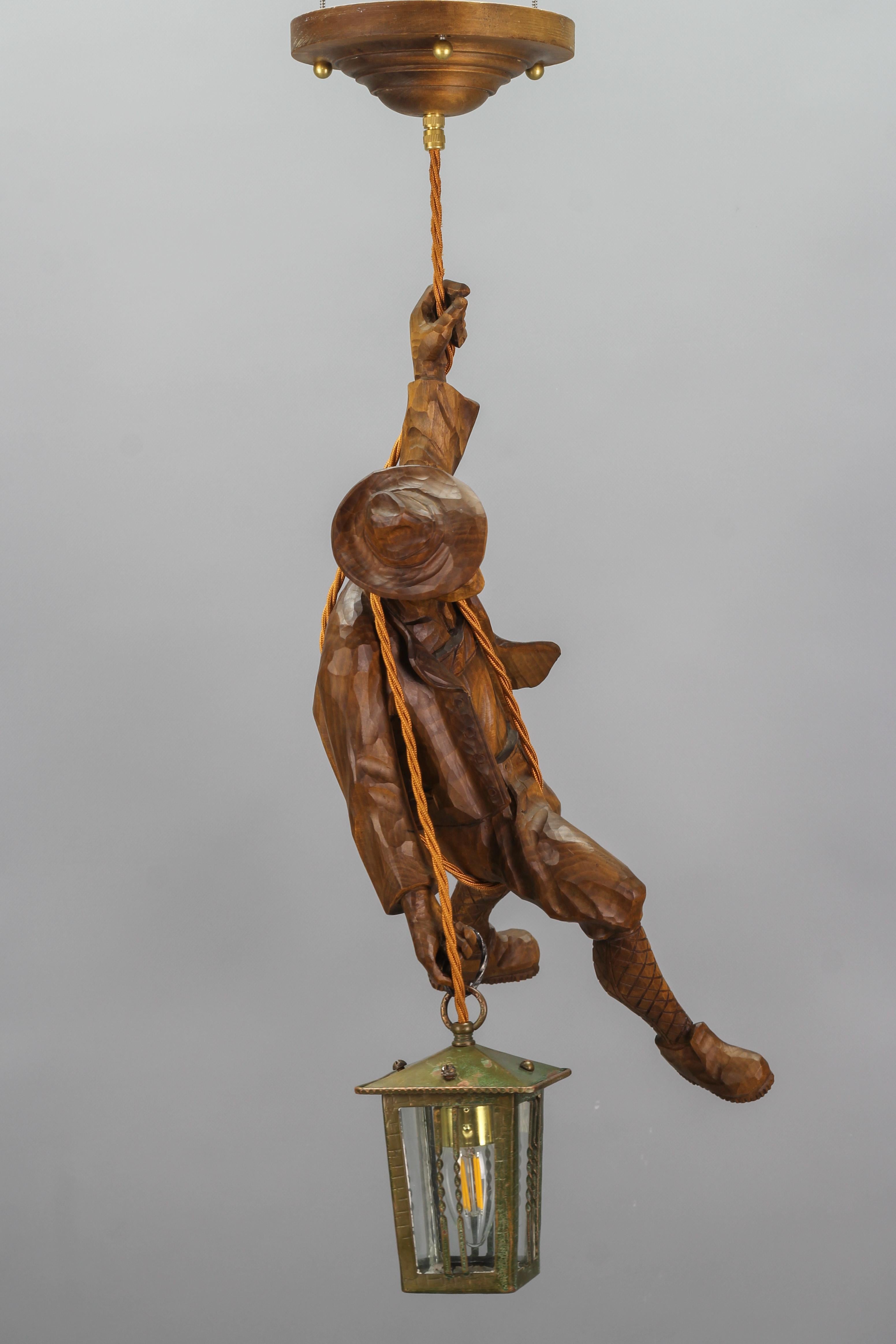 Hand-Carved German Pendant Light with a Carved Wooden Figure of Mountain Climber and Lantern For Sale