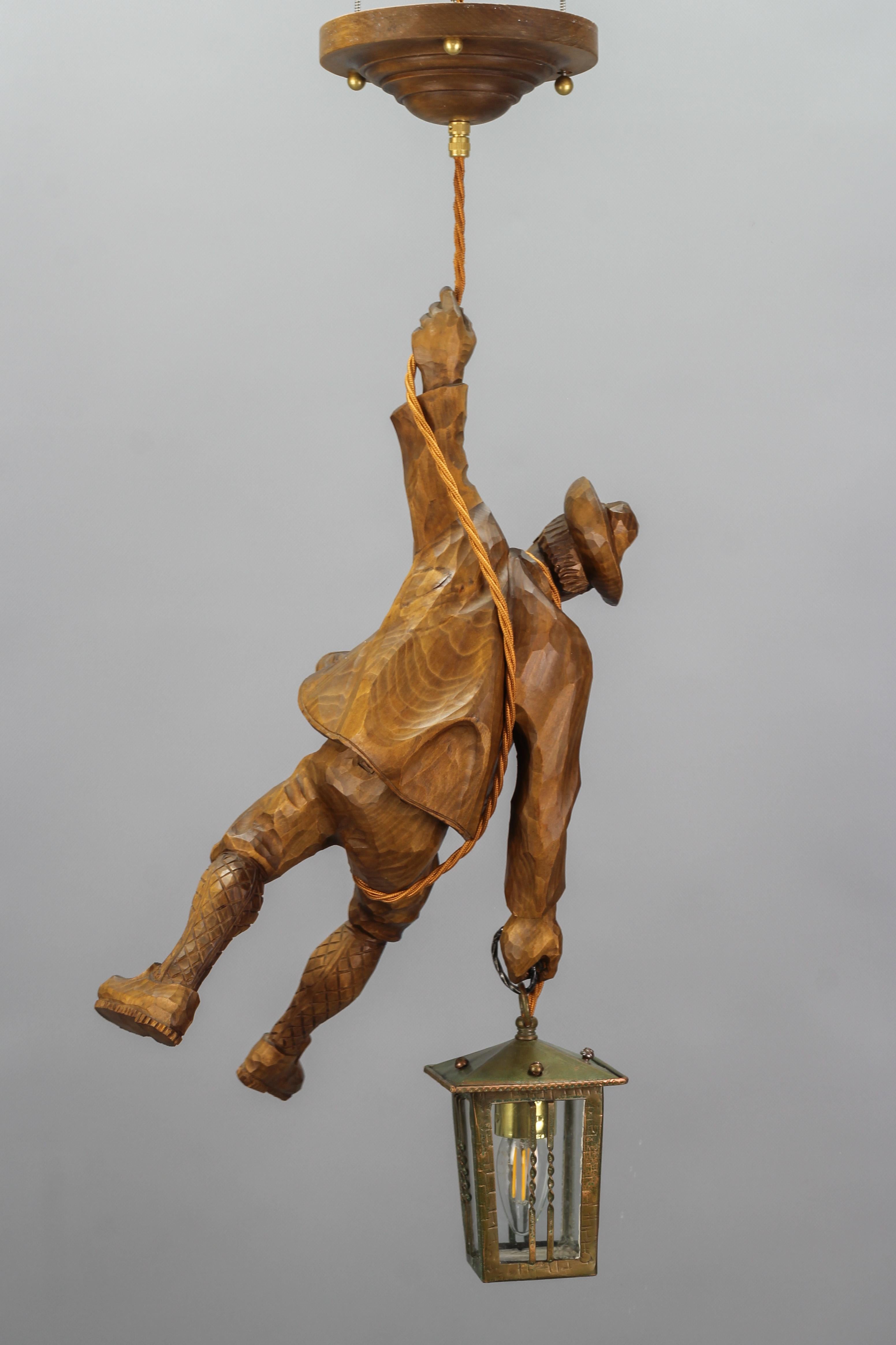 Mid-20th Century German Pendant Light with a Carved Wooden Figure of Mountain Climber and Lantern For Sale