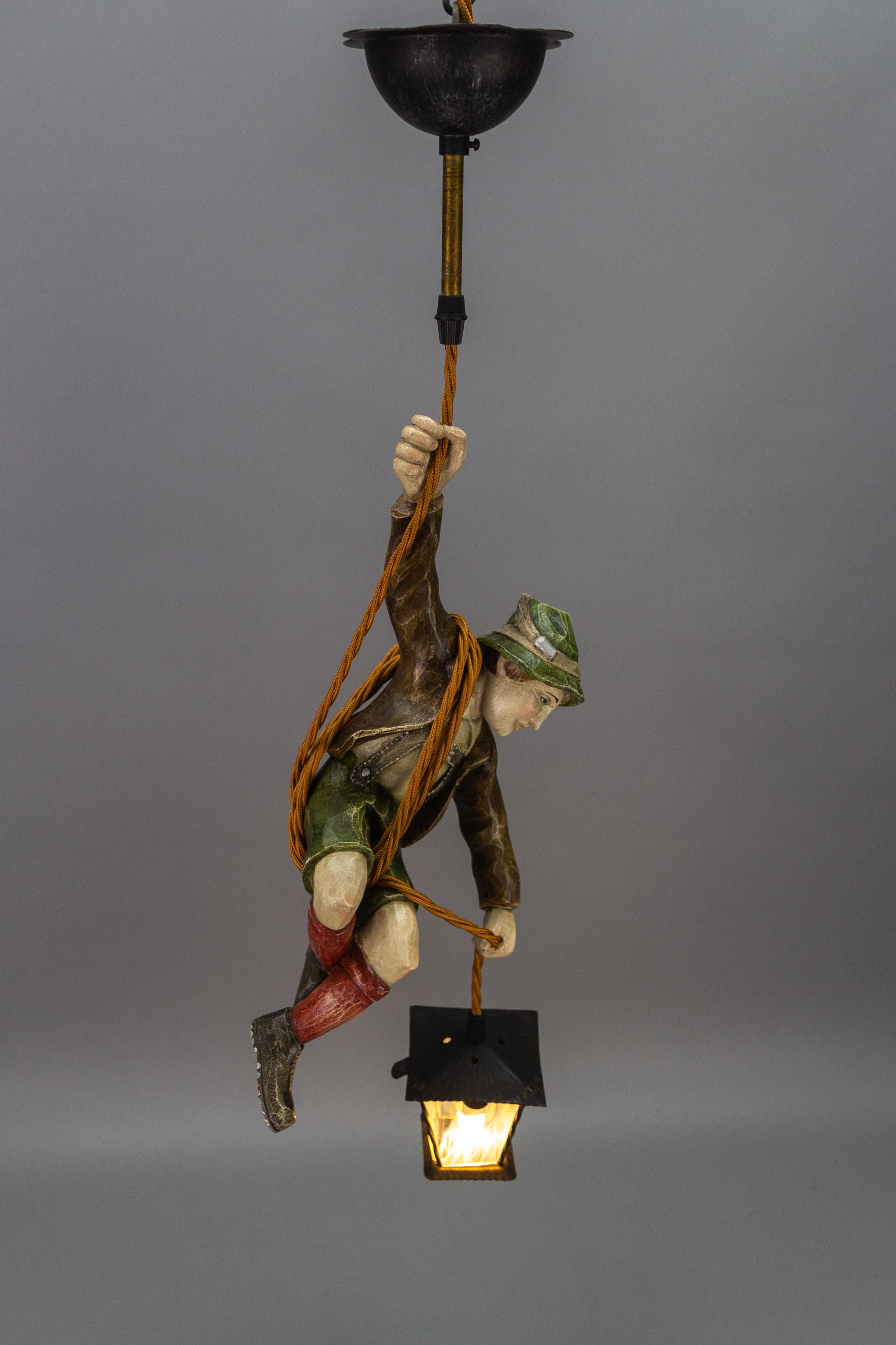 Black Forest German Pendant Light with Hand Carved Mountain Climber Sculpture and Lantern For Sale