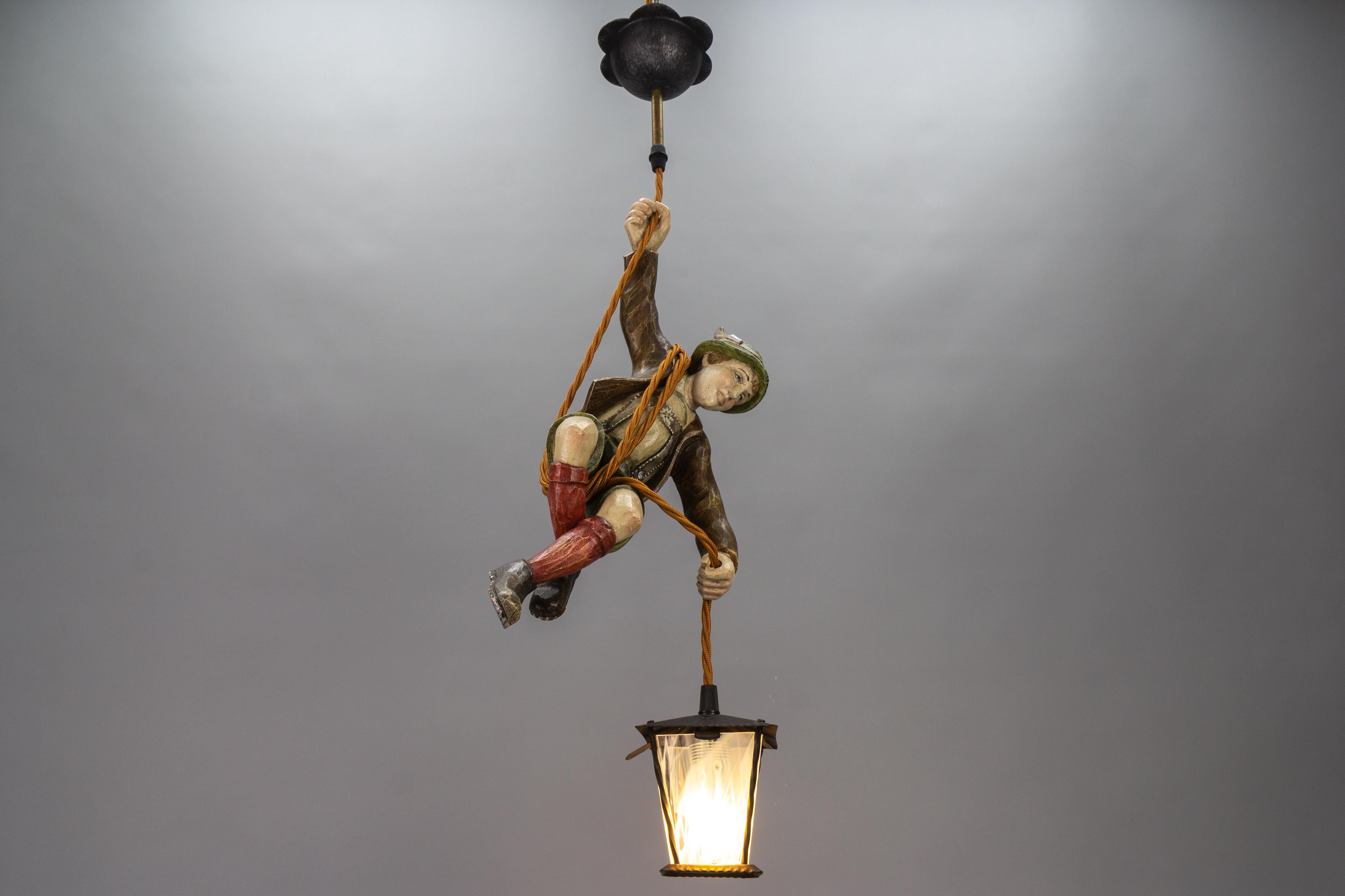 Hand-Carved German Pendant Light with Hand Carved Mountain Climber Sculpture and Lantern For Sale