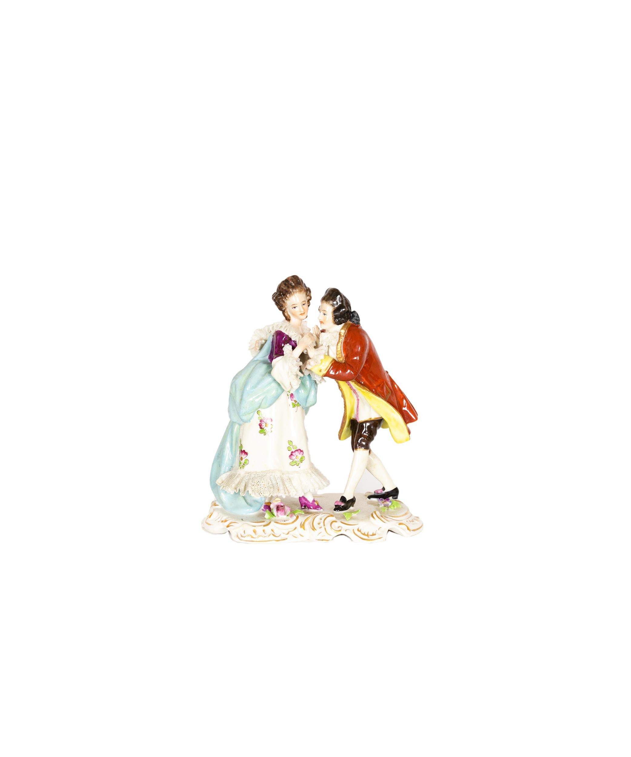 This german porcelain figurine, by Volkstedt, captures a sweet moment between a couple sharing a gentle kiss. 

Volkstedt was one of the top porcelain makers, it is marked on the bottom along with the date 1762, which is when the company was