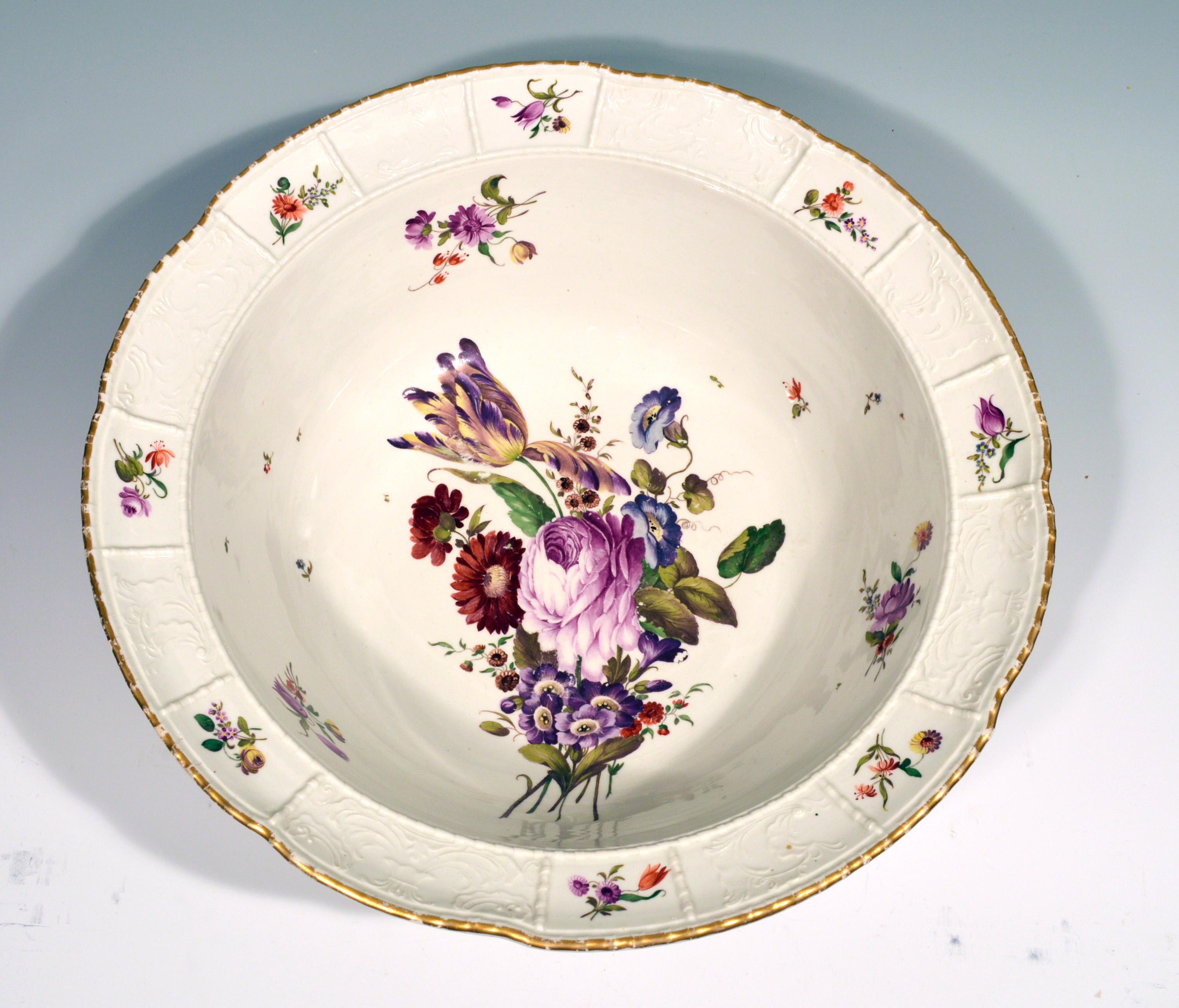 German porcelain large botanical bowl or basin, 
Ludwigsburg,
circa 1780.
(NY9095)

The large porcelain circular bowl or basin has a wide flaring rim. The rim is moulded with alternating rectangular panels with an undecorated moulded ribbon