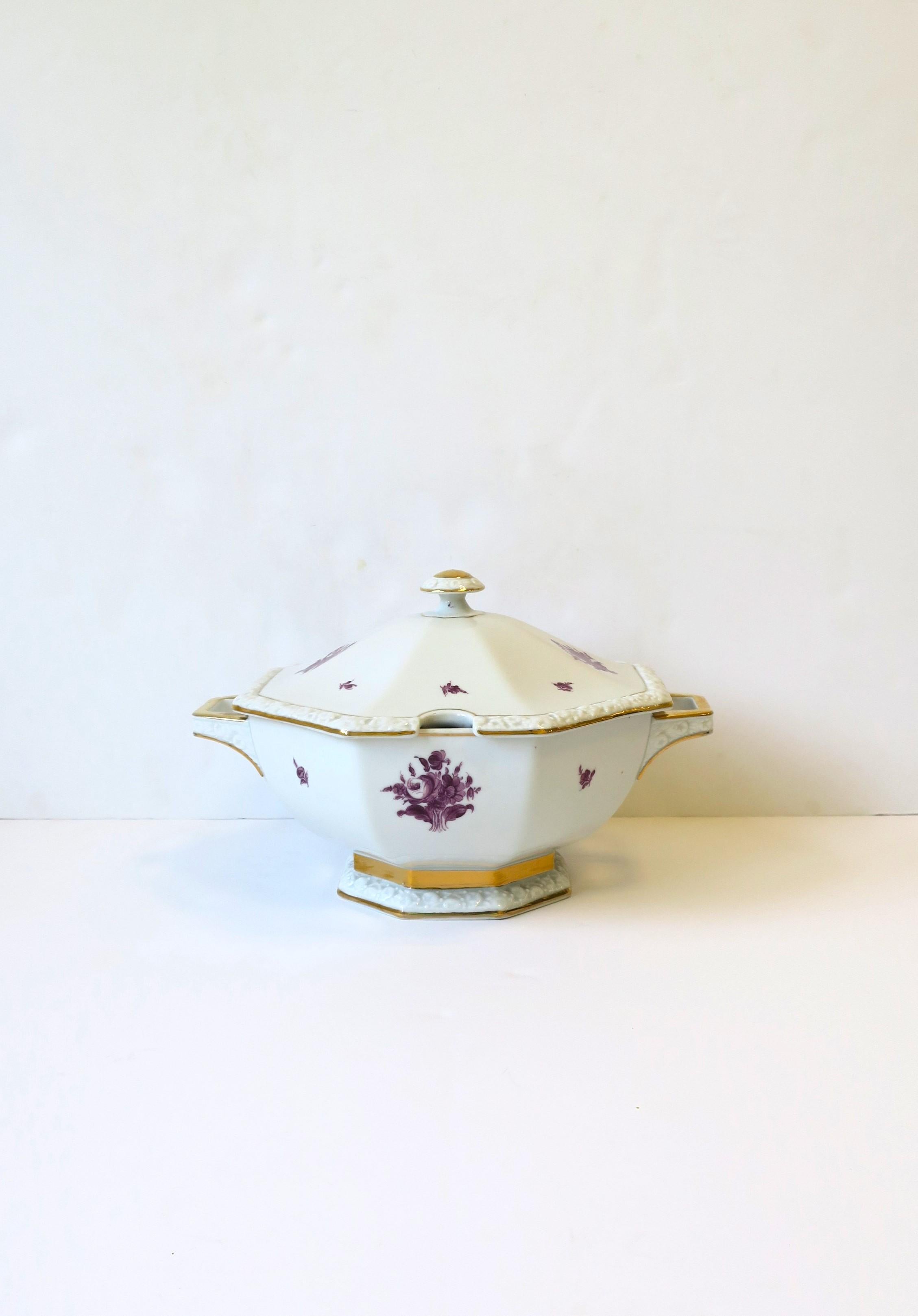 A German white porcelain soup stew tureen with hand-painted floral design and gold detail, circa mid to late-20th century, Germany. Tureen, with lid, has an octagonal shape and opening for spoon or ladle. Piece is hand-painted by artist with artist