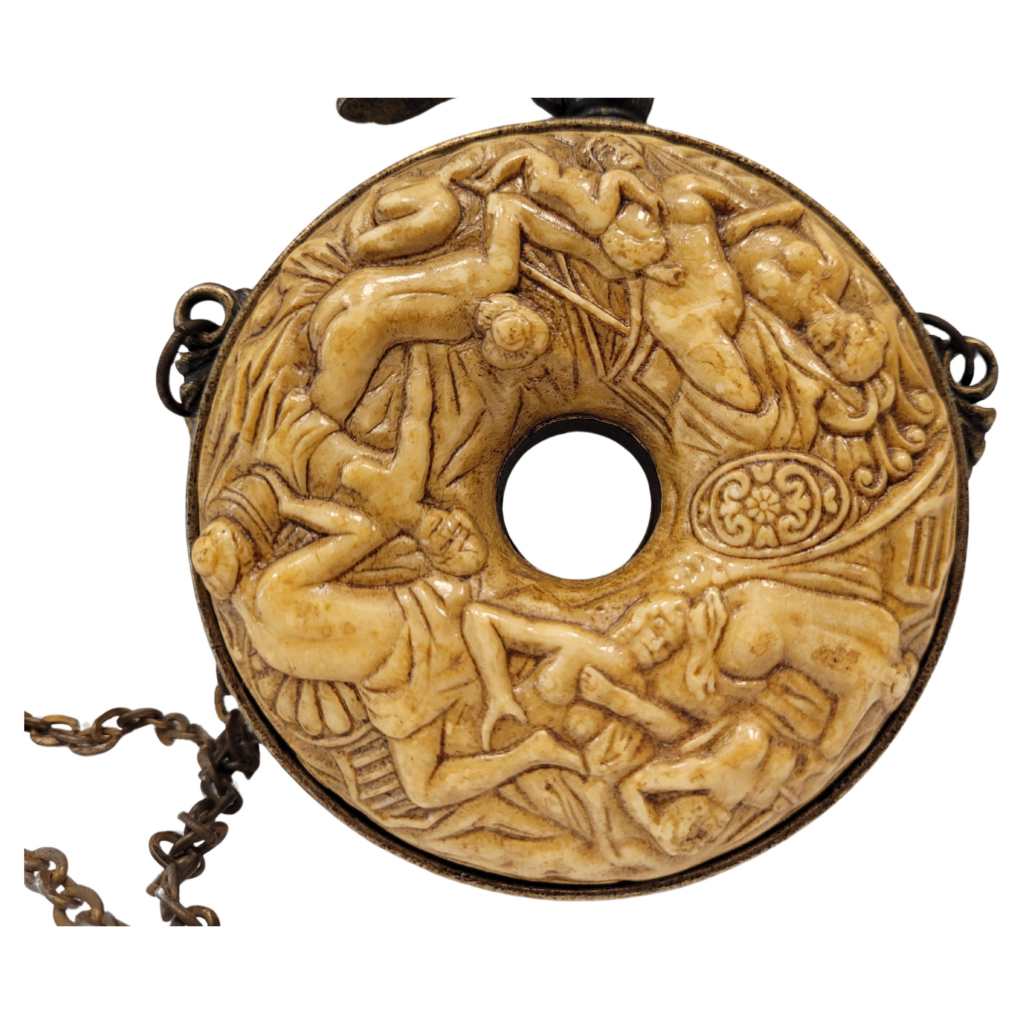 German powder pouch in carved bone representing bacchanals