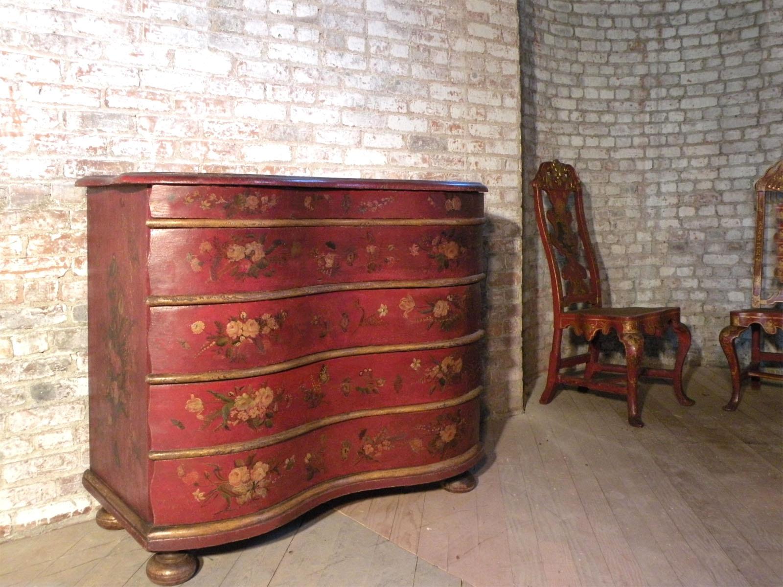 Large Floral Painted 18th Century Commode of German Origin with five drawers made of oak), serpentine front, on bun feet. Charming and very decorative with the red paint nicely distressed for a relaxed, lived-in look - or to be retouched for a more
